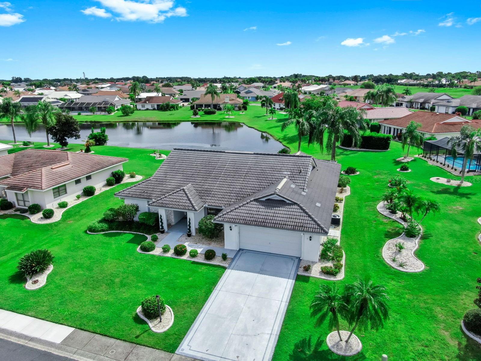 Welcome to 724 Elkhorn Rd, a beautifully maintained home in the heart of the sought-after 55+ community of Greenbriar in Sun City Center, where resort-style amenities and an active lifestyle await. This spacious home features a tile roof, 3 bedrooms, 2 bathrooms, both a living room and family room, and offers plenty of space for relaxing and entertaining. The updated kitchen boasts modern finishes, a breakfast bar, and flows seamlessly into the open living spaces. The split bedroom floor plan provides privacy for guests, while the primary suite offers comfort and a walk-out to the screened-in patio. Both bathrooms have already been updated, making this home truly move-in ready.
Huge Florida room with wet bar! Step outside to a huge screened-in patio with tranquil lake views surrounded by immaculate landscaping that enhances the curb appeal. Whether enjoying morning coffee or evening sunsets, this outdoor space is perfect for Florida living.
Residents enjoy access to world-class amenities including a swimming pool, fitness center, pickleball and racquetball courts, and social clubs. The location is unbeatable, just minutes from highways, shopping, dining, and medical facilities, with easy access to Tampa, Sarasota, and beautiful Gulf Coast beaches. Schedule your private showing today!