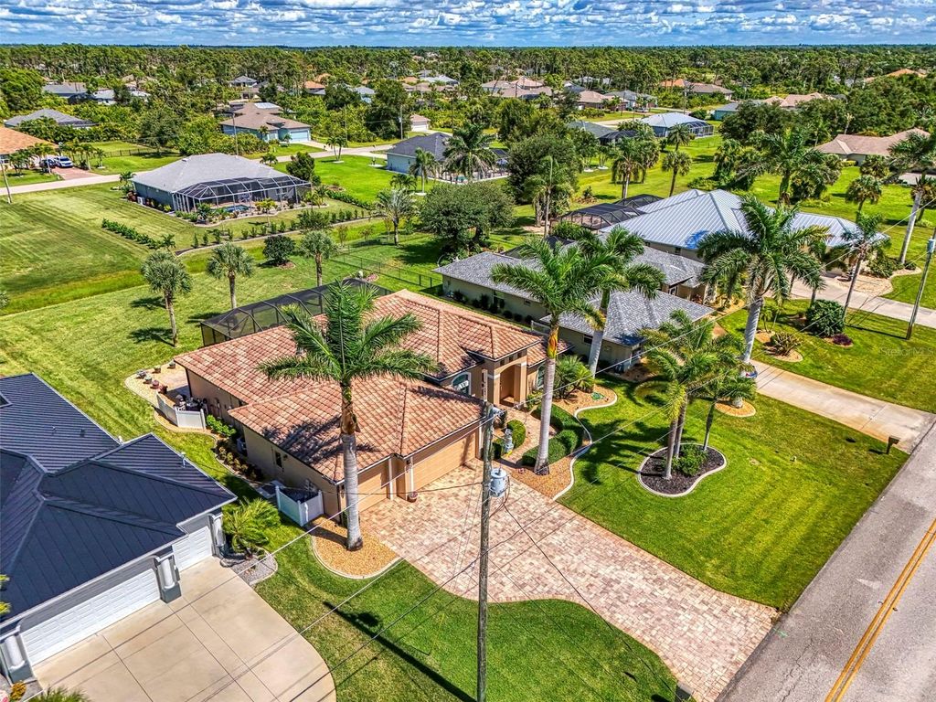 Photo of 715 Boundary Boulevard, Rotonda West, FL 33947 (MLS # D6143916)