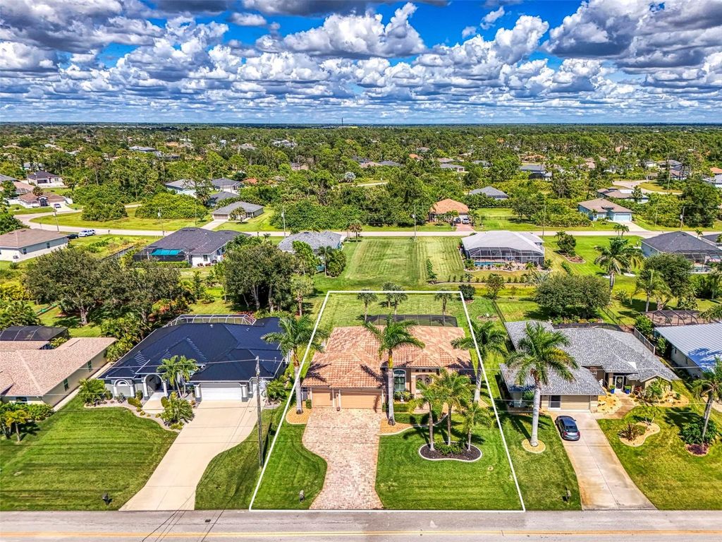 Photo of 715 Boundary Boulevard, Rotonda West, FL 33947 (MLS # D6143916)
