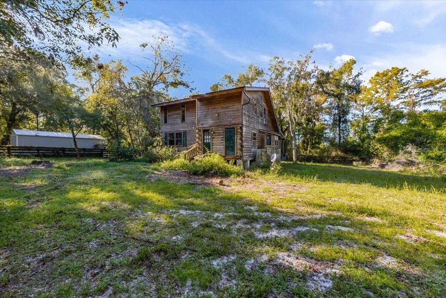 Handyman special located on a quiet dead-end street in Floral City. This 2-bedroom, 2-bath home offers 1,560 square feet of living area and features a wood-burning fireplace with brick fascia, cathedral ceilings, and a loft overlooking the main living room. Additional interior highlights include ceiling fans throughout and an interior washer and dryer hookup.The home is equipped with central heat and air, a durable metal roof, and an enclosed screened lanai for additional living space. The property is serviced by a well and septic system. The house is not located in an HOA or flood zone. The perimeter of the property is secured with chain-link fencing.Owner financing may be available. Buyer to verify all information.