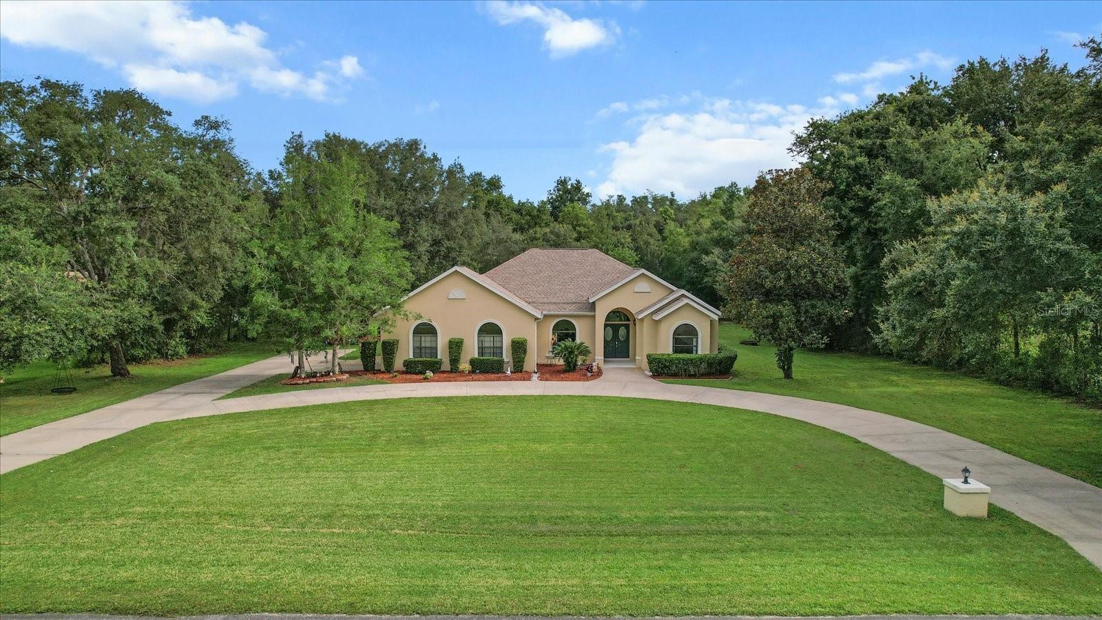 Need A Home for Your FULL HOUSE? Well… You Got it, Dude! This 6-bedroom/4 bath home, sitting on 1.21 acres, is the epitome of comfort, warmth and belonging. It’s the place to be… whether it’s for holiday gatherings poolside, watching Sunday football in the family room with the built-in entertainment center, afternoon card games in the nook with refreshments & treats at the dry bar, or providing the perfect ambiance to your distinguished guests in the front, formal rooms. The formal living and dining rooms are separated from the rest of the home and showcase a tray ceiling in the dining room, a DOUBLE tray in the living room, wall niche and lighted ledge with crown molding around the perimeter. Through the small alcove with built-in shelving and into the kitchen, you have entered the large common area where family can relax and let the good times roll! The kitchen boasts a double wall oven, separate cooktop, closet pantry, island with seating and a breakfast bar. A pass-through window from the kitchen to the lanai is super handy for those wonderful get-togethers! The amazing floor plan provides plenty of privacy and escape from your busy day with the master bedroom being located off the quiet, formal end of the house, while the guest hallway with the remaining 5 bedrooms is located off the family room at the other end of the home. The master bedroom features a tray ceiling of its own, dual walk-in closets, plant shelves and an ensuite with split vanities, makeup desk, garden tub, separate walk-in shower and linen closet. BONUS: A separate sitting room/office with a slider is just off the master bedroom. In the guest wing, the other bedrooms all have plant shelves and double bifold closets. There are so many closets… CLOSETS GALORE! There are 4 separate, additional closets in the guest hallway, as well as double bifold linen closets in the bathrooms. Saving the best for last, the covered lanai with the screen enclosed pool is the last stop and most welcome ending to your day! NEW ROOF, NEW HVAC & NEW TANKLESS WATER HEATER in 2025 for NO WORRIES! Full landscaping with an 8-zone irrigation system for convenience. A large circular driveway for all the comings and goings is a plus! No Flood Zone! Perfectly located in the Villages of Citrus Hills, which is only 5 miles away from Citrus County’s BRAND-NEW RETAIL HUB, The Shoppes of Black Diamond. This hot spot is a Shopper’s Delight, featuring many well-known retailers, as well as some of your favorite Big Box Stores. Remember all those closets! And of course, Crystal River is only 20 minutes away for fishing, kayaking, biking, nature walks and the only place to SWIM WITH THE MANATEES. A FREE 1yr HOME WARRANTY for peace of mind is OFFERED to the Buyer!