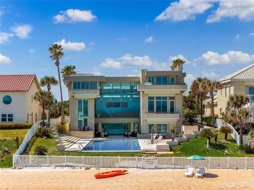 Amazing new price! Now available at an even better price. Luxurious oceanfront beach home. With its prime location, the beach is your backyard, while the prestigious golf course and country club are in front of the home. This three-story modern retreat is the epitome of elegance and sophistication, complete with a detached guest house for ultimate privacy. Spend your days relaxing on the beach, snorkeling, paddle boarding, kayaking or surfing from your backyard. Wake up to the stunning ocean sunrise every morning while sipping coffee by the pool. The outdoor living space is ideal for year-round entertainment or simply unwinding after a long day. Take a dip in the 63-foot infinity pool and feel like you are swimming in the ocean. The first floor gathering room will take your breath away, with its soaring 33-foot ceilings and glass walls showcasing the picturesque ocean view to the east and a private Zen garden to the west. The Zen garden is the ideal place to destress and connect with nature. Listen to the soothing sound of the waterfall as it flows into the koi pond, surrounded by lush palms, fruit trees and fragrant herbs. Retreat to the third-floor owner's suite, with breathtaking ocean views from your private balcony. The luxurious spa-like bath is the place to unwind and relax after a long day. Don't miss the opportunity to own this stunning oceanfront beach home and experience the ultimate luxury lifestyle.