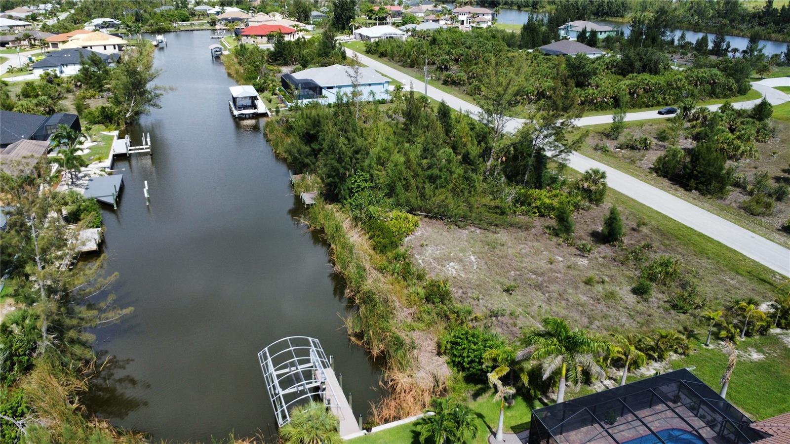 Build-Ready Waterfront Lot WITH PERMITS in South Gulf Cove – Direct Boating Access to Charlotte Harbor!
Don’t miss your chance to own this 82x125 waterfront lot in the thriving, deed-restricted community of South Gulf Cove. This exceptional property at 10462 Poughkeepsie Circle comes with approved building permits, giving you a valuable head start on constructing your custom Florida home or investment property.
Situated along a quiet residential street, this lot offers direct boating access to Charlotte Harbor and the Gulf of Mexico, making it perfect for boating enthusiasts and anglers alike. Enjoy picturesque sunsets and the laid-back waterfront lifestyle right from your backyard.
The lot is equipped with public water and sewer, and is surrounded by a mix of well-kept homes and new development. Welcoming community with access to a boat ramp, park, walking trails, clubhouse, and a wide variety of social activities and clubs.
Located just minutes from Gulf beaches, golf courses, shopping, restaurants, and two MLB Spring Training facilities (Tampa Bay Rays and Atlanta Braves), this homesite puts the best of Southwest Florida at your fingertips.
WITH PERMITS in place, this is a rare turnkey opportunity—start building immediately and bring your waterfront vision to life.
