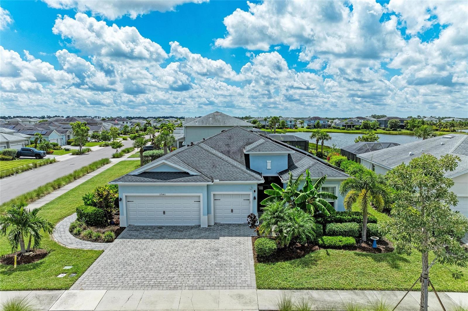 Welcome to this beautiful 3-BEDROOM PLUS DEN, 3-BATHROOM, 3-CAR GARAGE home offering over 2,400 sq. ft. under air in the highly sought-after Trails Edge neighborhood of Babcock Ranch – America’s first solar-powered town. Perfectly positioned on a SPACIOUS CORNER LOT with SERENE LAKE VIEWS, this residence blends modern comfort with energy efficiency, just a short walk to the neighborhood school and minutes from Publix, shopping, and dining. Inside, you’ll love the bright, open-concept layout featuring a LARGE GREAT ROOM that seamlessly connects the kitchen and dining area—ideal for family living and hosting gatherings. The DEN offers flexibility as a home office, study space, or even a 4th bedroom for guests. Outdoors, enjoy your HEATED SALTWATER SPORT POOL AND SPILL-OVER SPA, thoughtfully designed with the deep end in the middle—perfect for play, exercise, or relaxation. A PAVER WALKWAY extends from the driveway along the side of the home to your own PROFESSIONAL PUTTING GREEN, then wraps around to a CIRCULAR SEATING AREA where you can take in beautiful, tranquil views of the lake—the perfect spot for morning coffee or an evening lakeside retreat. Additional highlights include ELECTRIC CAR CHARGER, SOLAR PANELS that not only power the home but also GENERATE EXTRA ELECTRICITY PURCHASED BACK BY FPL—earning the current owners a considerable refund each year. The home IS NOT LOCATED IN A FLOOD ZONE and is equipped with HURRICANE SHUTTERS. The insulated garage doors, and a portable A/C unit provide ideal space for storage or workspace. The large SCREENED FRONT ENTRYWAY offers a warm welcome and a great option for cool breezy nights. The Trails Edge’s community boasts a low HOA fee that covers lawn care, high-speed internet, and access to the community’s abundant amenities. Experience the vibrant lifestyle of Babcock Ranch, with parks, walking trails, golf course, waterpark, community events, and more—all in a family-friendly lakefront setting. Schedule your private showing with the listing agent today.BE SURE TO CLICK THE FULL VIRTUAL TOUR LINKS FOR DETAILS!