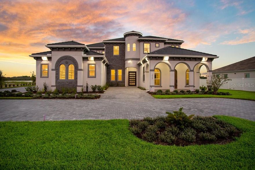 Get ready to enjoy the lake lifestyle in your brand-new custom home poised on almost an acre lot with 120+ feet of shoreline. This masterpiece of a home that has never been lived in and has it all with 7 bedrooms, 6 bathrooms, 2 powder baths, loft, media room, office with its own private entrance, elevator, two laundry rooms, massive 4 car garage, and plenty more! The stately home was designed to enjoy the breathtaking panoramic views of Huckleberry Lake with the utmost comfort and privacy. The grand façade combines new Mediterranean and contemporary architecture complimented with a halfmoon driveway, courtyard, and large custom front door. Upon entry you will immediately notice 23’ soaring high ceilings in the foyer, porcelain floors, and a chic staircase. Sit back, relax, and take in your beautiful lake views from the great room which is open to the kitchen and casual dining space. The chef’s kitchen is a dream come true with a large center island, breakfast bar seating, glass tile backsplash, pendant lighting, walk-in pantry, natural gas cooktop, pot filler, stainless steel appliances, two dishwashers, smart refrigerator, and double oven. The elegant dining room is perfect for those formal occasions with its own butler’s pantry and wainscotting. Work from home in peace with your own office away from the living areas with vaulted ceilings, sound insulation, and a private covered entrance. Master suite is conveniently located on the main level with two large built-in walk-in closets, spa like bathroom including a glass shower, tub, and dual vanities. There is also a guest bedroom on the main level overlooking the lake with its own walk-in closet and bathroom. Take either your own elevator or stairs to the upstairs spacious loft with its own wet bar making game nights ideal for entertaining family and friends. There is also an adjacent media room that can be used as a theater, gym, or additional flex space. All secondary bedrooms are en-suites with plenty of closet space. Relax and enjoy captivating sunsets and nightly Disney fireworks within the serenity of the expansive outdoor living area that is fully screened in with pavers. The covered lanai has already been plumbed for a swimming pool and summer kitchen. Huckleberry Lake has its own ski course with jump ramp offering endless watersport activities including great fishing. Additionally, the neighborhood has it’s own community pool, splash pad, and playground. Winter Garden offers great schools, close proximity to restaurants, shopping, and attractions. Be prepared to enjoy the extraordinary lake lifestyle this property offers to anyone that passes through its doors. Seller would also consider a lease. 

<iframe width='853' height='480' src=https://my.matterport.com/show/?m=E2c8kYvUbim&mls=1></iframe>