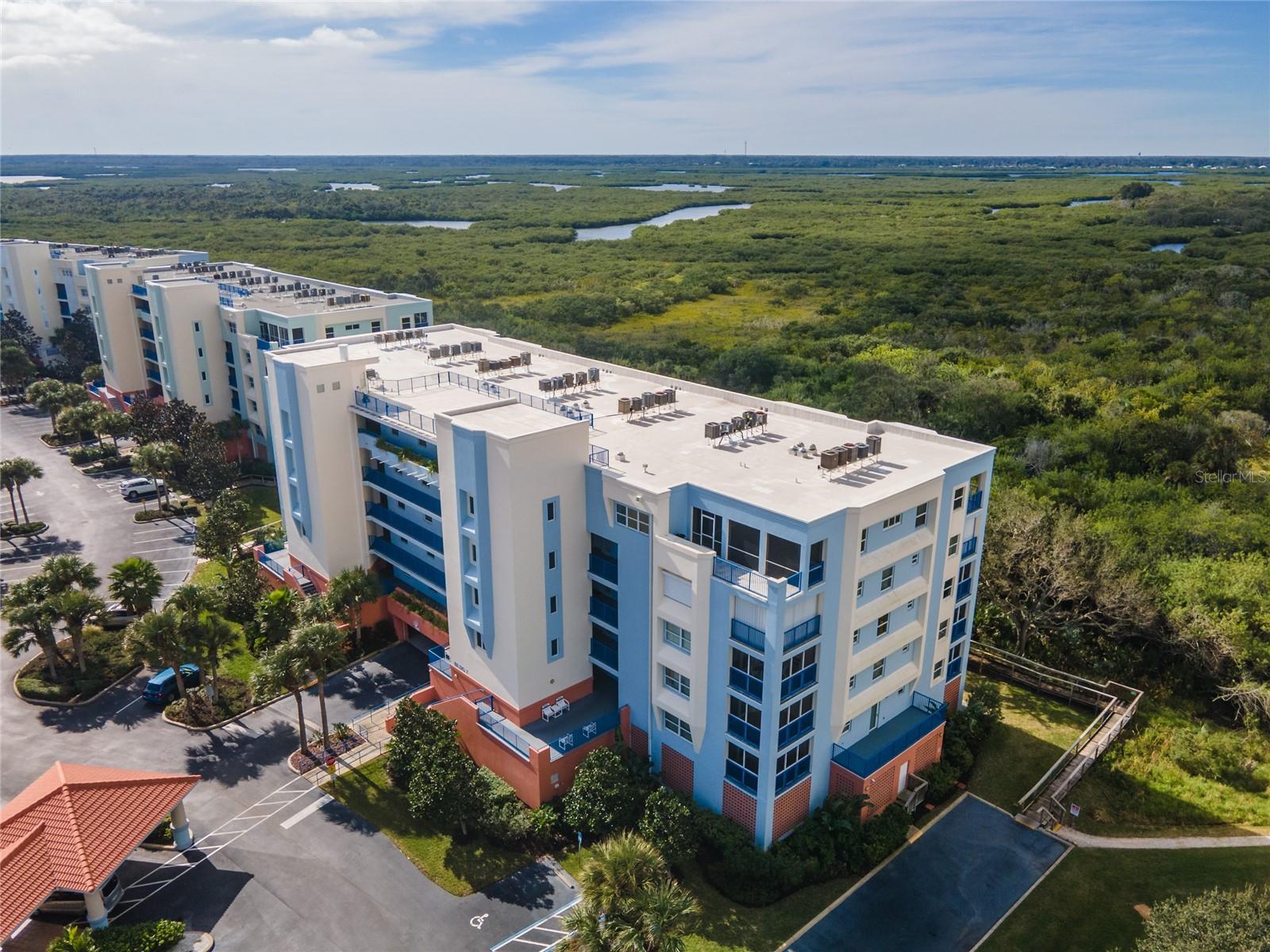Welcome to coastal living at its finest in the highly sought-after Oceanwalk community of New Smyrna Beach. Ideally situated on the 3rd floor, this beautifully maintained 2-bedroom, 2-bath condominium offers the perfect blend of comfort, convenience, and resort-style living—just steps away from the clubhouse, pool, and the pristine no-drive portion of the beach. Built in 2005, this spacious residence features a thoughtful split floor plan, placing the guest suite at the front and the primary suite toward the rear for added privacy. The open living area flows seamlessly onto a generous balcony, ideal for enjoying the Florida breeze. Tile flooring in the main living areas and plush carpeting in the bedrooms create a welcoming and low-maintenance environment. Offered fully furnished and turn-key, this home is equipped with a new washer and dryer, as well as a newly installed wireless door keypad for added convenience and security. Whether you’re seeking a full-time residence, a weekend retreat, or a lucrative short-term rental, this property is ready to meet your needs. Oceanwalk offers an unparalleled array of resort-style amenities designed to elevate your coastal lifestyle, including two sparkling pools, multiple tennis courts, jacuzzi, two fitness centers, a private movie theater, shuffleboard, two clubhouses, outdoor gas grills, and more. The community is fully gated with secure access and includes one assigned garage parking space beneath the building, plus ample open parking nearby. Enjoy the ease of a private beach walkover just moments from your door, offering direct access to one of Florida’s most treasured stretches of coastline. Don’t miss this exceptional opportunity to own a well-appointed, move-in ready condo in one of New Smyrna Beach’s most desirable communities. Come experience the very best of the Florida lifestyle—your piece of paradise awaits.