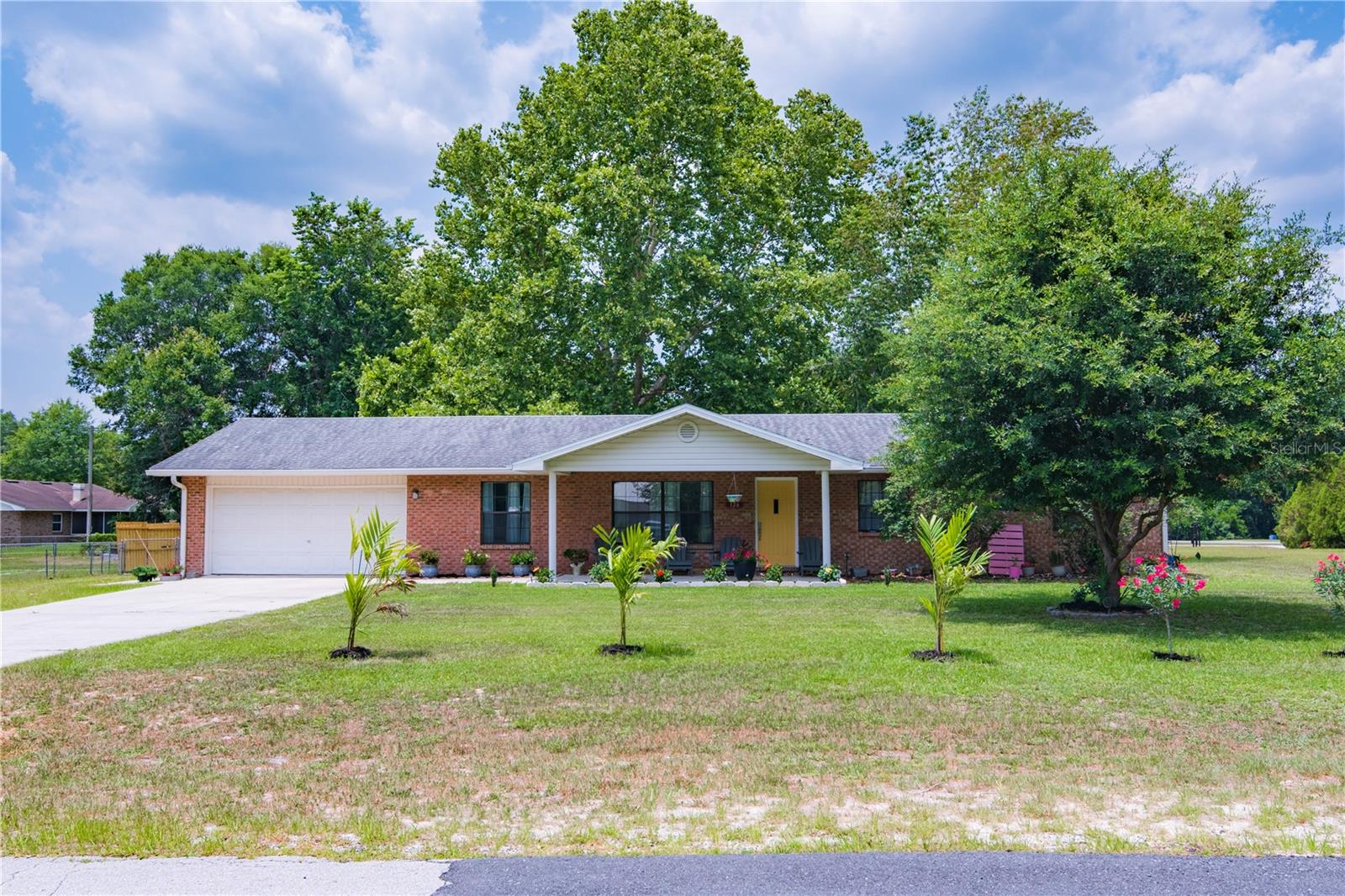 NO HOA, NO DEED RESTRICTIONS! Don't miss this rare opportunity to own this move-in ready, 3/2, on expansive 0.65-acre, fenced, corner lot! Located in a prime location and situated near shopping, restaurants, hospitals, and I-75 this property combines convenience with serene suburban charm. Home has been meticulously cared for and boasts modern updates including having been re-roofed and re-plumbed since its original construction, ensuring peace of mind and long-term durability. Rest easy knowing this property is situated outside a flood zone offering added security. Kitchen has real wood cabinets, granite counter tops, stainless steel appliances and even a second, built-in oven for preparing large meals. The spacious layout features a living room, dining room, family room, and a bonus room/den perfect for a home office, playroom, or even a cozy sitting room with lots of windows where you can relax and enjoy views of your very own private oasis. Call today and schedule a tour before this home is gone!