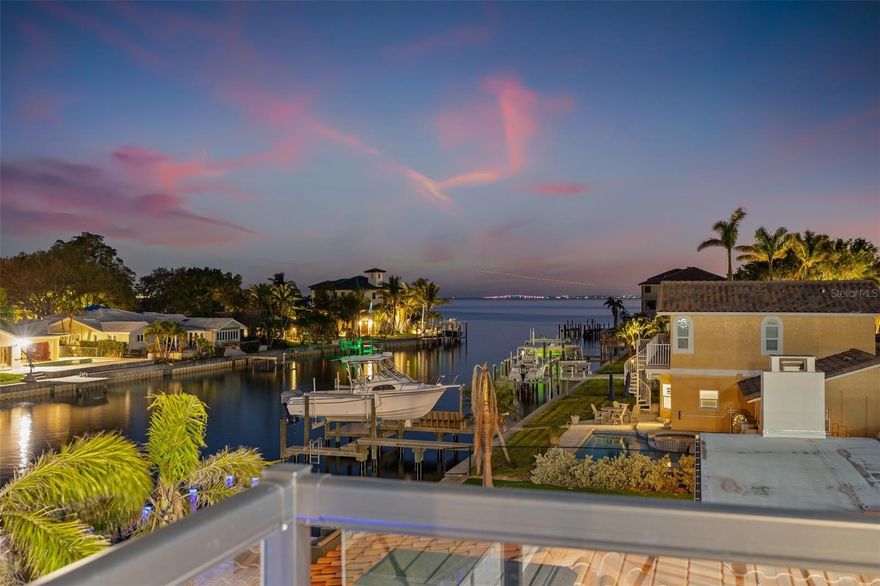 Experience modern waterfront luxury in this brand-new custom residence offering 5 bedrooms, 6 full baths, 1 half bath and a rare 4-car garage on protected sailboat water with breathtaking open bay views. With 5,600+ square feet of living space, this home is ideally located in one of Northeast St. Petersburg’s most desirable waterfront neighborhoods.

Step inside to a light-filled open floor plan featuring a dramatic 22-foot ceiling, a striking wall of glass doors, and seamless indoor-outdoor living with panoramic water views—perfect for entertaining and everyday luxury.

The chef’s kitchen is the heart of the home, showcasing Wolf and Bosch stainless appliances, a massive 16-foot quartz island with seating for six, custom cabinetry, and a walk-in pantry with prep station. The adjacent waterfront dining area flows effortlessly to the resort-style outdoor living space.

Outside, enjoy a heated pool and spa, outdoor kitchen, and expansive deck—ideal for sunset cocktails, al fresco dining, and entertaining on the water.

This exceptional home features two owner’s suites (one on each level), each with spa-inspired baths offering freestanding soaking tubs, dual vanities, quartz countertops, and frameless glass showers. All additional bedrooms include private en-suite baths, providing comfort and privacy for family and guests.

Upstairs, a spacious entertainment lounge with bar, wine refrigerator, and glass-enclosed wine display opens to a private waterfront terrace. A bonus room offers flexibility as a gym, theater, or game room, and a main-level office can easily convert to a sixth bedroom.

Additional highlights include impact-rated windows and doors, energy-efficient construction, and smart home technology with integrated lighting and sound.

Located just minutes from Downtown St. Petersburg, enjoy easy access to waterfront parks, award-winning dining, shopping, arts, and a walkable urban lifestyle.

Luxury. Location. Waterfront.
Schedule your private showing today and experience the best of St. Pete waterfront living.