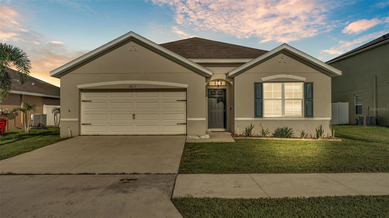 Welcome to this beautifully designed 4-bedroom, 2-bathroom home that blends comfort, style, and functionality—perfect for modern living and entertaining. Located in the Magnolia Green neighborhood of Plant City, this home features an open floorplan that invites natural light and effortless flow throughout the living spaces. The heart of the home is the spacious kitchen, complete with a large island with bar seating, glass tile backsplash, stainless steel appliances, modern pendant lighting, a coffee bar, and a closet pantry for extra storage. The living and dining areas seamlessly connect to the kitchen, creating an inviting space for gatherings. Thoughtful feature walls and sliding glass doors add character and provide easy access to the screened-in lanai, perfect for relaxing or entertaining outdoors. The primary bedroom offers a quiet retreat with a walk-in closet and a full en suite bathroom for added privacy and convenience. The extra bedrooms give everyone a nice spot to relax after a long day. You could also turn one of them into a home office, just as it is currently, if you want. The fully fenced backyard provides plenty of space for pets, play, or gardening. From the lanai, you can see a large pond behind the home as well as lush greenery with no rear neighbors. The community is well-maintained and features a park/playground as well as a community pool. Don’t miss your opportunity to own this stylish and well-appointed home with space to live, entertain, and enjoy!