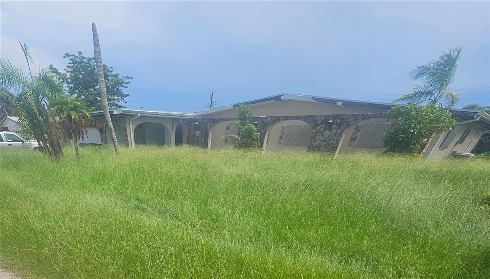This unique and versatile property offers incredible potential for a variety of living arrangements. Thoughtfully designed with accessibility in mind, the home features handicap-accessible ramps throughout to accommodate elevation changes, as well as a 4-foot-wide main hallway and an oversized roll-in shower (5’ x 7.5’)—making it ideal for those with mobility needs.
With five spacious bedrooms and four-and-a-half bathrooms, this residence could comfortably serve as a large family home, multigenerational living space, or even as an assisted living or group home setup. There's also potential for a separate mother-in-law suite with its own private entrance.
Additional highlights include a generously sized pool with 8-foot depth, a large screened lanai, and a hot tub (currently not in use) that could be restored to its former glory. A free-standing shed in the rear yard offers extra storage, though it will require some repair. The roof is only three years old, though some soffit and fascia work is needed. A previously enclosed fireplace presents the opportunity to be reopened and enjoyed once again.
Ready for its next chapter, this home offers space, functionality, and flexibility in a way few properties can.