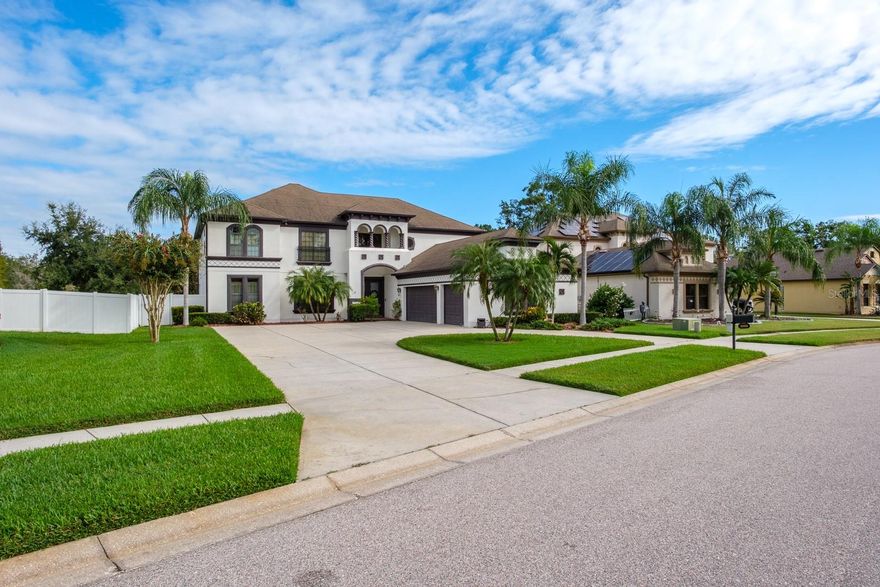 Wow! This grand home on a premium homesite in prestigious Deerfield Village is packed with updates and designed to impress. From the moment you step through the double-door entry, you’re greeted with soaring vaulted ceilings, a grand staircase, abundant natural light, and luxury vinyl plank flooring throughout – no carpet anywhere! There is lovely crown molding and architectural effects in the formal living room and formal dining room. The dining room boasts a stunning designer chandelier. The thoughtfully reimagined and updated kitchen is a true chef’s dream, featuring 42-inch cabinets, granite counters, a spacious island with storage, farmhouse sink, double oven, stainless appliances, breakfast bar, walk-in pantry and a large eat-in area with beautiful French door entry to the lanai. The family room is equally inviting, with cathedral ceilings and natural light pouring in through triple sliders that open to the private backyard oasis. Entertaining and family space is extended as you step outside and soak in the perfect Florida lifestyle! The covered patio includes an outdoor sink and separate pool bath, while the screened lanai surrounds a sparkling saltwater pool with spa. Beyond the lanai, you’ll find a lush lawn with serene pond views and no rear neighbors. The enormous backyard is fully fenced for ultimate privacy. The first-floor primary suite is a luxurious retreat with a beautifully renovated ensuite bath, offering a spacious shower, soaking tub, dual sinks, and a custom finished walk-in closet. A second bedroom and full bath are also conveniently located on the main floor – ideal for guests or multigenerational living. Upstairs, you’ll find three additional bedrooms, an office, and a generous bonus room. Upgrades galore including designer light fixtures, extensive crown molding, arched doorways and beautiful architectural design, custom cellular shades, and a 3-car garage and the impressive elevation of this home is accented by the large circular driveway. This home truly has it all – space, style, upgrades, and an unbeatable backyard on a premium homesite in a sought-after community. Don’t miss your chance to see it!