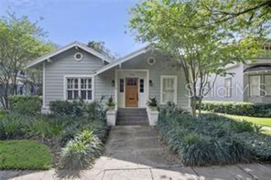 Lifestyle living at its best! Walk to Hyde Park Village, shop & dine. Exercise & take in the scenic Bayshore Blvd views. Enjoy all this historic neighborhood has to offer! Inside, the large foyer has gorgeous hardwood floors and crown molding that continues throughout the home. A quaint sitting area with built in shelving and pocket doors is at the front of the home. The great room has a beautiful brick fireplace and wall pocket shelves flanking the opening to the dining room that has wainscoting capped with plate/picture shelf. A hallway takes you to the half bath and the 2 bedrooms. Both bedrooms have sleek en suite bathrooms with decorative vanity cabinets and tiled rain showers and the master bedroom has a large walk in closet. The kitchen has saltillo tile floors, marble countertops and stainless steel appliances including a Wolfe gas range, Sub Zero refrigerator and wine refrigerator. Outside the private fenced backyard is a dream with lush landscaping and a brick and concrete patio. The detached 1 1/2 car garage can be easily accessed through the driveway with a remote control gate.