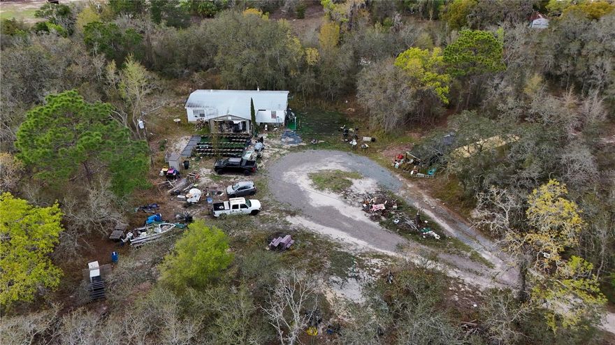 This 5.60-acre parcel located in Hudson, FL with no wetlands and situated in Flood Zone X, providing flexibility for a variety of future uses. This property presents a great opportunity to create a private estate, family compound, small farm, or investment project.
The property includes a mobile home that will not qualify for traditional financing and is being sold As-Is. The structure may have potential for repair or replacement depending on the buyer’s plans.
 Lot has electricity, a well with capacity to service up to four homes, and an existing septic tank, providing a starting point for future development.
With 5.60 acres of usable land, buyers may explore possibilities such as multi-generational living, agricultural use, or potential lot division, subject to county approval. 
Buyer is responsible for conducting all due diligence with Pasco County regarding zoning, future development, lot division, impact fees, and permitting requirements.