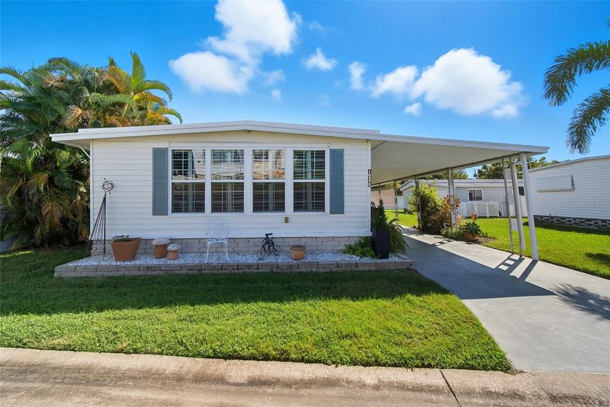***More Pictures to Follow***  Wow this Beautiful 2/2 Home is located in Resident Owned Holiday Shores Park located on Lake Seminole. This Park allows 2 Small Pets and has a very Social and active Clubhouse.. Amenities include Heated Pool ,Community Boat Ramp  for Boating or Kayaking on the Lake for the day. Also Private Fishing  areas and Gazebo Park like setting to relax. Covered Shuffleboard Courts, Billiard Room and Chipping area for Golfers. This Updated home has a Light and bright Living Room and a Spacious Enclosed Florida Room with Double Pane Windows and Custom made Window Shutters. The kitchen is upgraded with Appliances and Stylish Cabinetry and Granite counter tops and a nice bar for eating and entertaining off the kitchen.The Dinning Room has a Custom built in Buffett with storage for entertaining. Fashionable Upgraded Lighting fixtures thru-out, which adds a Designer touch. The Master Bedroom is Spacious with a lovely Ensuite Bathroom and custom built vanity with  sink and cabinets with a Granite top. Guest Bedroom is light and bright and has a large closet for storage. Guest Bathroom also has been updated including cabinetry and Fixtures. Other updates include HVAC in 2021 and Roof -Over  of the home including the Florida Room and the Shed outside the Carport which is where the Washer and dryer is located.  Nice Private Back-Yard  that has a Warm Southern Exposure for Cool Florida Days to Sun. Holiday Shores is located less than an Hour to 2 Major Airports, also Less than 30 minutes to the Amazing Award Winning Gulf Beaches! Take advantage of all the Sporting Event Venues all year around, that the Tampa Bay offers!! This Truly is Florida at it's Best!!