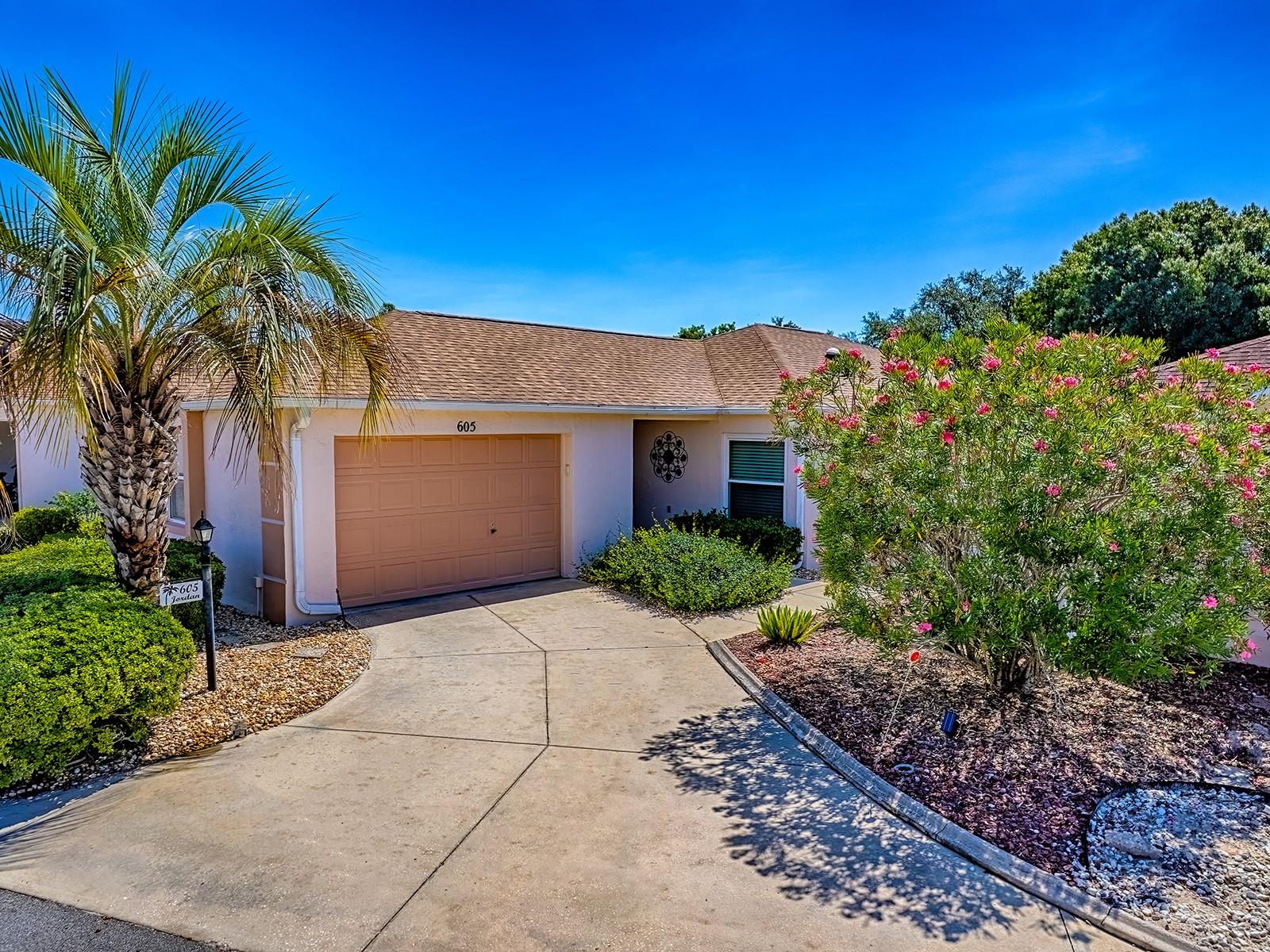 NO BOND~ ~2025 ROOF~ ~ENCLOSED LANAI~ ~LOW MAINTENANCE~ ~GREAT LOCATION~ This charming 2/2 Block/Stucco Courtyard Villa is nestled in the Village of DE LA MESA. Upon entering, you are welcomed into a cozy living and dining area offering Crown Molding & LAMINATE WOOD-LOOK FLOORING. Just around the corner, the galley kitchen awaits with updated cabinetry, a CLOSET PANTRY and a functional layout. The primary bedroom has a walk-in closet, and sliding glass doors leading out to the enclosed lanai. Its Ensuite bath showcases an ENLARGED UPDATED WALK-IN SHOWER. The guest bedroom provides a comfortable space for visitors with the guest bath adjacent. Step into the ENCLOSED LANAI which overlooks the PRIVATE backyard. From the dining room, sliding doors open to the side yard and lead to the backyard, where a concrete patio creates the perfect setting for outdoor entertaining and grilling. The ROOF is 2025, the HVAC is 2023. De La Mesa is a rare gem with its own PRIVATE POOL AND PARK - available exclusively to residents and their guests-offering a quiet, neighborhood feel along with a vibrant social calendar. This villa is ideally situated just minutes from both Spanish Springs Town Square & Lake Sumter Landing, where you'll enjoy live entertainment, dining, shopping, and all the conveniences of The Villages. Whether you're looking for an INVESTMENT PROPERTY, SEASONAL GETAWAY, or a FULL-TIME HOME, this Villa delivers!