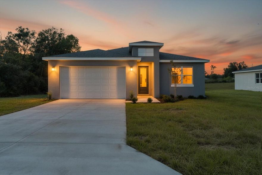 This is the home you have been waiting on, an impeccable designed 4-bedroom 3-bathroom situated on private lot with no rear neighbors in a central location in the Marion Oaks Community. From the moment you arrive you will notice the difference with top-of-the-line modern craftsmanship and striking Builder upgrades like Waterproof LVP flooring throughout (NO CARPET), All custom order SOLID CORE factory black doors, chic matte black fixtures, and outdoor security flood lights. The stunningly designed kitchen showcases 42'' upper cabinets, statement piece entertaining island, Calacatta White Quartz countertops, Samsung stainless steel appliance suite, glass backsplash, and an oversized walk-in pantry. The main living space has tons of natural light, and the open concept is perfect for entertaining family and friends. The Owner’s Suite showcases dual sink vanity, chic shower with glass enclosure, and walk-in closet. The guest bedrooms are roomy, with both Guest Bathrooms featuring designer floor to ceiling tile and Bathtub/Shower combo. Indoor Laundry has plenty of storage and Samsung washer & dryer are included as well. The French doors lead out to the fully covered lanai which is the perfect extension of the homes living space for enjoying the beautiful Florida sunshine. BUILDER INCENTIVES available including CLOSING COST assistance and interest rate BuyDown! Inquire about our available programs. Schedule your private showing today and experience why this home set it’s apart from all the others!
