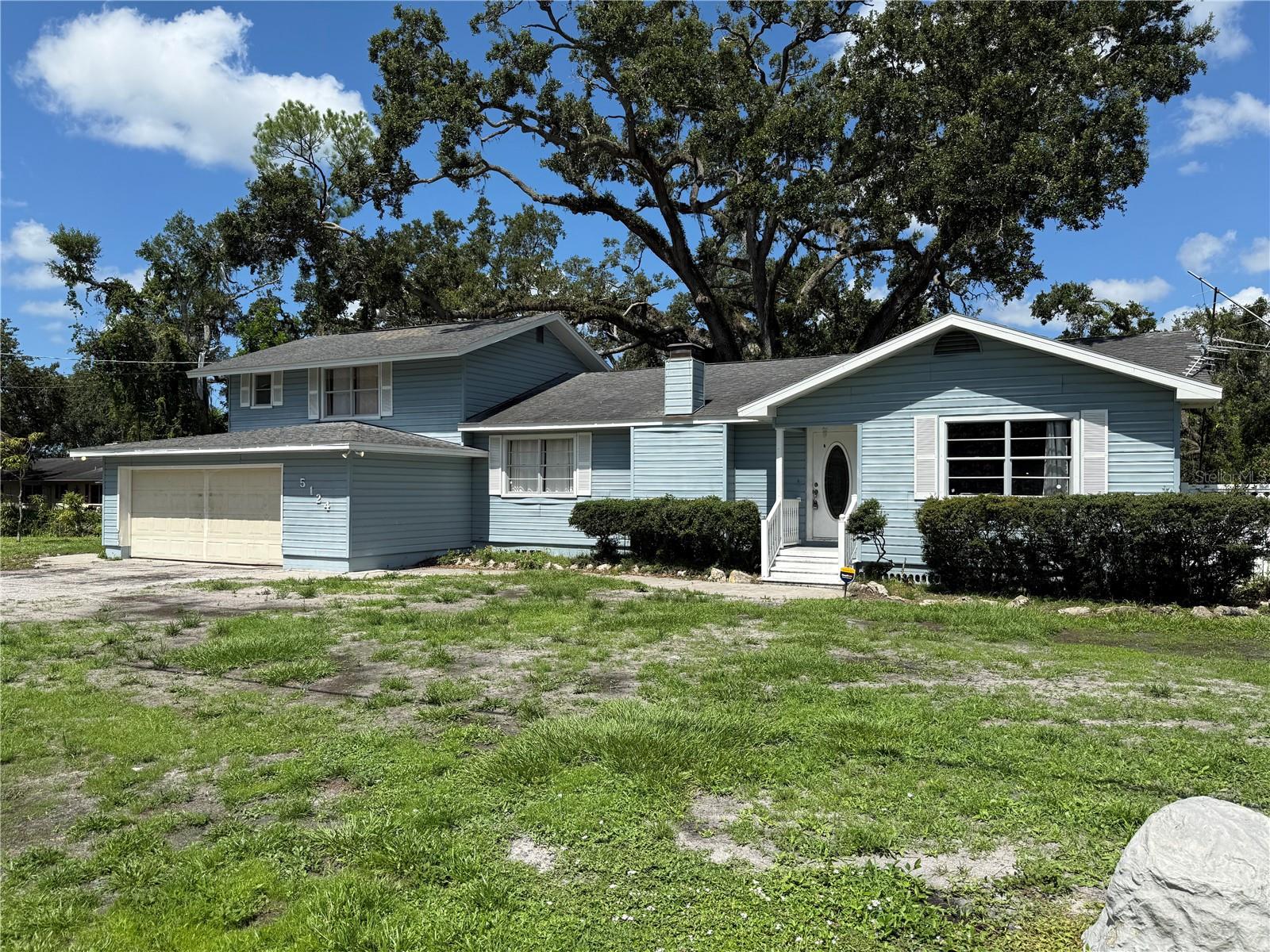 Here’s your chance to own a sizable property in the heart of Bradenton with real potential. Tucked away on a quiet streett, this 4-bedroom, 3-bath home sits on an oversized 0.42-acre lot—nearly half an acre with no HOA, no CDD, and no deed restrictions. Whether you're looking to create a long-term homestead, invest in a renovation project, or build sweat equity, this one has the bones and the breathing room to make it happen.
Inside, the layout offers flexibility for a variety of lifestyles. There’s a wood-burning fireplace in the main living area, a screened lanai for outdoor living, and a rare oversized two-car garage with extra space for a workshop or storage. The primary bedroom is privately located upstairs and features a large walk-in closet and en-suite bath. Secondary bedrooms and bathrooms are located on the main floor.
The home does need significant updating—flooring, kitchen, baths, and finishes—but the footprint is solid, and the space is there. There’s room to rework and reimagine the flow to suit your needs. The lot provides plenty of space to expand, add a pool, or just enjoy having extra room between you and the neighbors.
Conveniently located with quick access to SR 70, US-301, and downtown Bradenton, this is a central spot that puts you close to shopping, schools, and Gulf beaches while still giving you that classic Florida backyard feel.
Bring your vision and make this property your own.