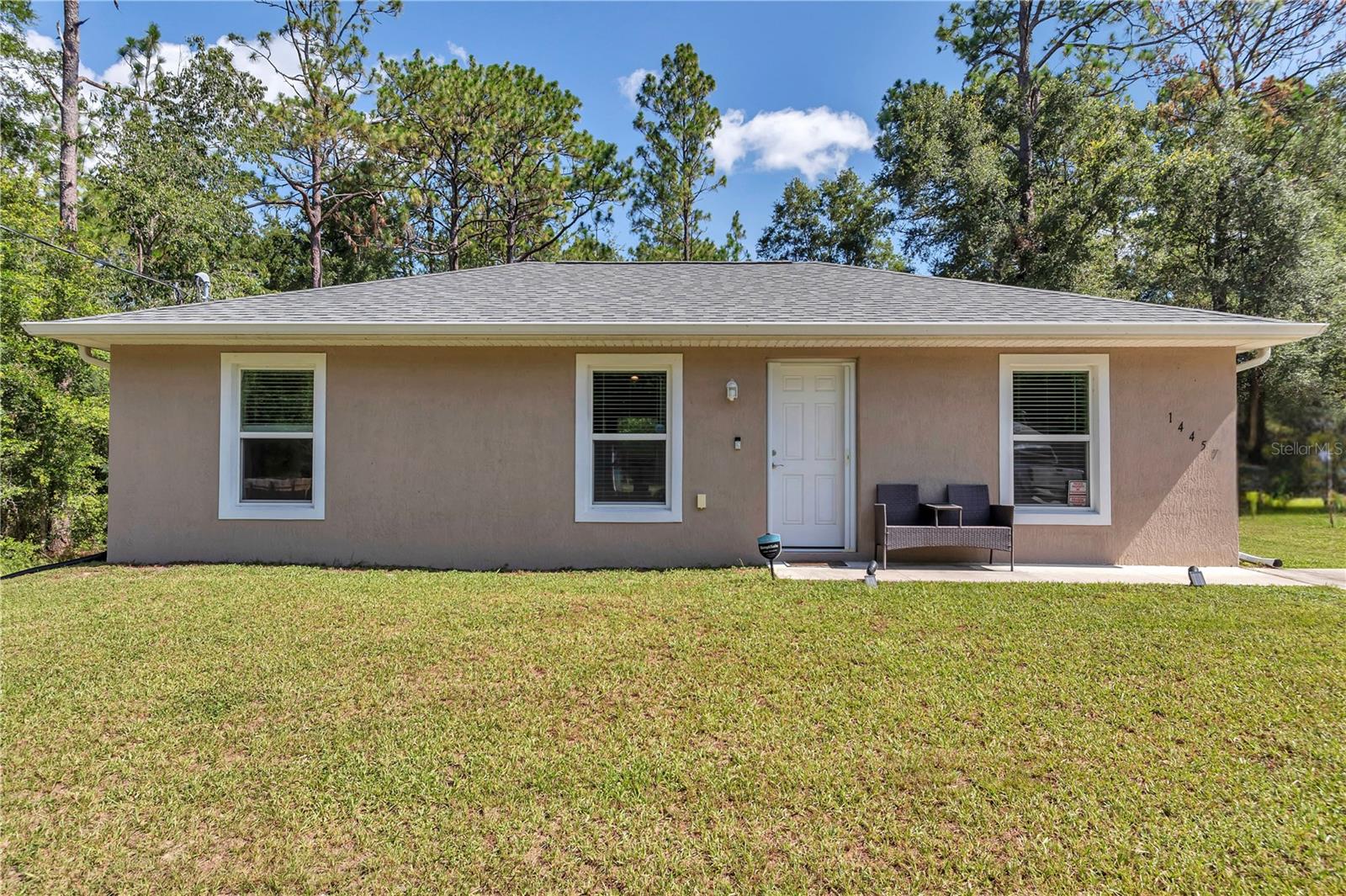 Welcome to your practically brand-new 3 bedroom, 2 bathroom split floor plan home in Ocala! Built in 2022, this beautifully maintained property has been thoughtfully upgraded by the current owner, making it completely move-in ready. Inside, you’ll find brand new granite countertops throughout, an open and airy layout, and blinds on all windows and the back sliding doors for comfort and style. The split floor plan offers added privacy, with the primary suite separated from the additional bedrooms; perfect for families, guests, or a home office setup.
Situated in a NO HOA area, this home offers added privacy with no neighbors to the left or behind you. Outside, the seller has installed gutters and added a 10’ x 10’ storage shed, perfect for tools, hobbies, or extra storage space. The backyard provides plenty of room for entertaining, gardening, or simply relaxing in your own private oasis. With the home being so new, you’ll enjoy peace of mind knowing the roof, AC, appliances, and major systems are all just a few years old. Enjoy an ideal location just 15 minutes from Downtown Ocala and less than 10 minutes to the World Equestrian Center, with shopping, dining, and everyday conveniences close by. Don’t wait for new construction—this upgraded gem is ready for you today! EASY TO SHOW-Schedule your showing today!!