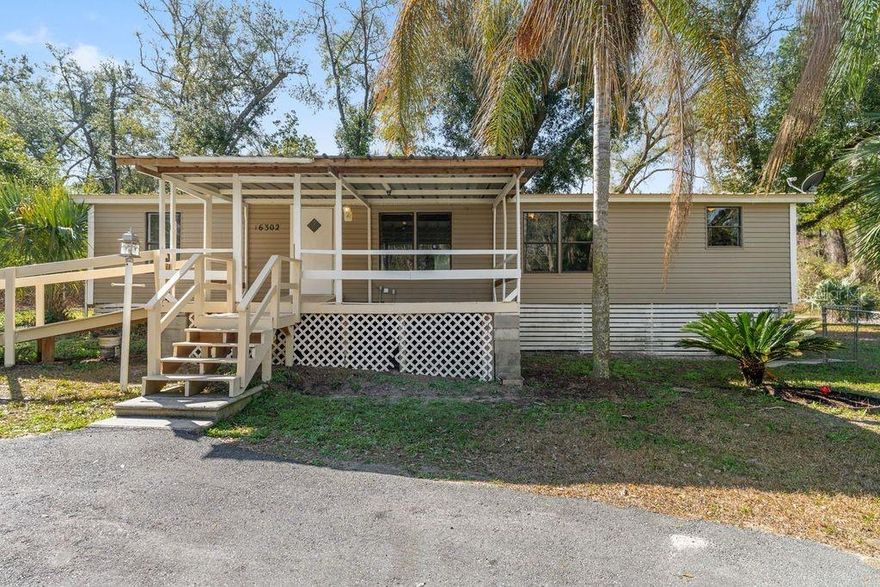 Welcome to the desirable Woods & Lakes community! This 3-bedroom, 2-bath manufactured home, offers 1,248 square feet of comfortable living space situated on a spacious corner lot aprox. .33 acres MOL — giving you room to spread out and enjoy the Florida lifestyle.  Fenced in yard for enjoyment.  Primary bedroom has a walk-in closet and its own bath room. 

Built in 1987, this home features a functional split-bedroom floor plan, generous living area, and plenty of natural light. With no HOA fees and no minimum lease period, this property offers flexibility whether you're looking for a primary residence, seasonal retreat, or investment opportunity.  Convenient to grocery store, library, gas station, tackle shop, etc.  You need to see this place for yourself!

Enjoy having a large fenced lot with room for gardening, outdoor entertaining, pets, or storing your recreational toys. Located in Flood Zone X for added peace of mind. The Woods & Lakes subdivision is known for its relaxed atmosphere while still being convenient to Ocala,  Lake Bryant, The Villages, and outdoor recreation areas.  Away from the big city but still close enough to  the grocery store, library, gas station, tackle shop, etc.  You need to see this place for yourself!

Schedule your showing today!  Buyer and buyer’s agent to verify all information.