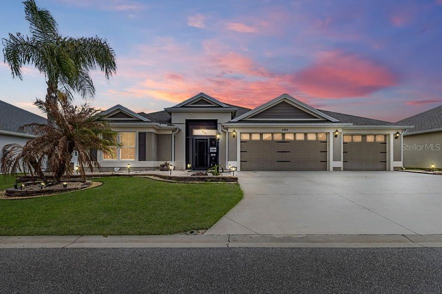 WELCOME TO YOUR PRIVATE RETREAT IN THE HIGHLY DESIRABLE VILLAGE OF MARSH BEND! Perfectly positioned just steps from the HOGEYE TRAIL WALKING PATH, this BEAUTIFULLY MAINTAINED BLOCK & STUCCO DESIGNER HOME offers the ideal combination of comfort, space, and The Villages lifestyle.

This S~T~R~E~T~C~H~E~D LILY MODEL features 3 BEDROOMS, 2 BATHROOMS, AND 1,923 SQ. FT. OF LIVING SPACE and is offered FURNISHED / TURNKEY, making it truly move-in ready. From the moment you arrive, you’ll notice ENHANCED LANDSCAPING, GUTTERS AROUND THE ENTIRE HOME, AND STRONG CURB APPEAL, along with a SCREENED FRONT ENTRY that sets the tone for what’s inside.

Step into a bright, open interior highlighted by SOARING CEILINGS and LARGE WINDOWS THAT FILL THE HOME WITH NATURAL LIGHT. The heart of the home is the GOURMET KITCHEN, featuring UPGRADED STAINLESS STEEL APPLIANCES, AN EXPANSIVE ISLAND, GRANITE COUNTERTOPS, CUSTOM SPICE RACK, AND ABUNDANT CABINETRY, making it perfect for both everyday living and entertaining. CROWN MOLDING AND CUSTOM CORNICES THROUGHOUT add an upscale finish.

The O V E R S I Z E D PRIMARY SUITE is a true retreat with a VAULTED TRAY CEILING, GENEROUS ROOM SIZE, WALK-IN CLOSET, AND A SPA-LIKE EN SUITE BATHROOM offering DUAL SINKS, BUILT-IN LINEN STORAGE, PRIVATE WATER CLOSET, and a GORGEOUS CORNER WALK-IN SHOWER with GLASS-BLOCK ACCENTS

Guest accommodations are thoughtfully designed with TWO ADDITIONAL BEDROOMS TUCKED BEHIND A POCKET DOOR FOR MAXIMUM PRIVACY. Bedroom two and three feature BUILT-IN CLOSETS and the guest bath includes A TILED TUB/SHOWER COMBO, and a HALL LINEN CLOSET.

A CENTRALLY LOCATED INTERIOR LAUNDRY ROOM WITH EXTRA CABINETRY adds convenience, while the garage is where this home really separates itself from the pack—an OVERSIZED FULL 3-CAR GARAGE that can easily accommodate 2 CARS AND 2 GOLF CARTS, complete with EPOXY FLOORING, CUSTOM LED LIGHTING, UTILITY SINK, AND PULL-DOWN ATTIC STAIRS WITH MORE CUSTOM LED LIGHTING.

Outdoor living is just as impressive with an EXPANSIVE SCREENED LANAI OFFERING APPROXIMATELY 350 SQ. FT. OF ADDITIONAL LIVING SPACE, overlooking SERENE GREEN SPACE. The BIRDCAGE WITH A ONE-YEAR-OLD HOT TUB (APPROX. $20K VALUE) creates the perfect setting for relaxing or entertaining year-round.

Located just minutes from WATER LILY RECREATION CENTER, LOWLANDS EXECUTIVE GOLF COURSE, CATTAIL PICKLEBALL COMPLEX, EVERGLADES and FENNEY RECREATION CENTERS, and close to shopping and dining at BROWNWOOD PADDOCK SQUARE, SAWGRASS GROVE, and the EASTPORT TOWN CENTER, this home is right in the middle of everything that makes The Villages so desirable.

This TURNKEY DESIGNER HOME offers the rare combination of SPACE, LOCATION, AND HIGH-END FEATURES—DON’T MISS YOUR OPPORTUNITY TO MAKE THIS INCREDIBLE HOME YOUR OWN!