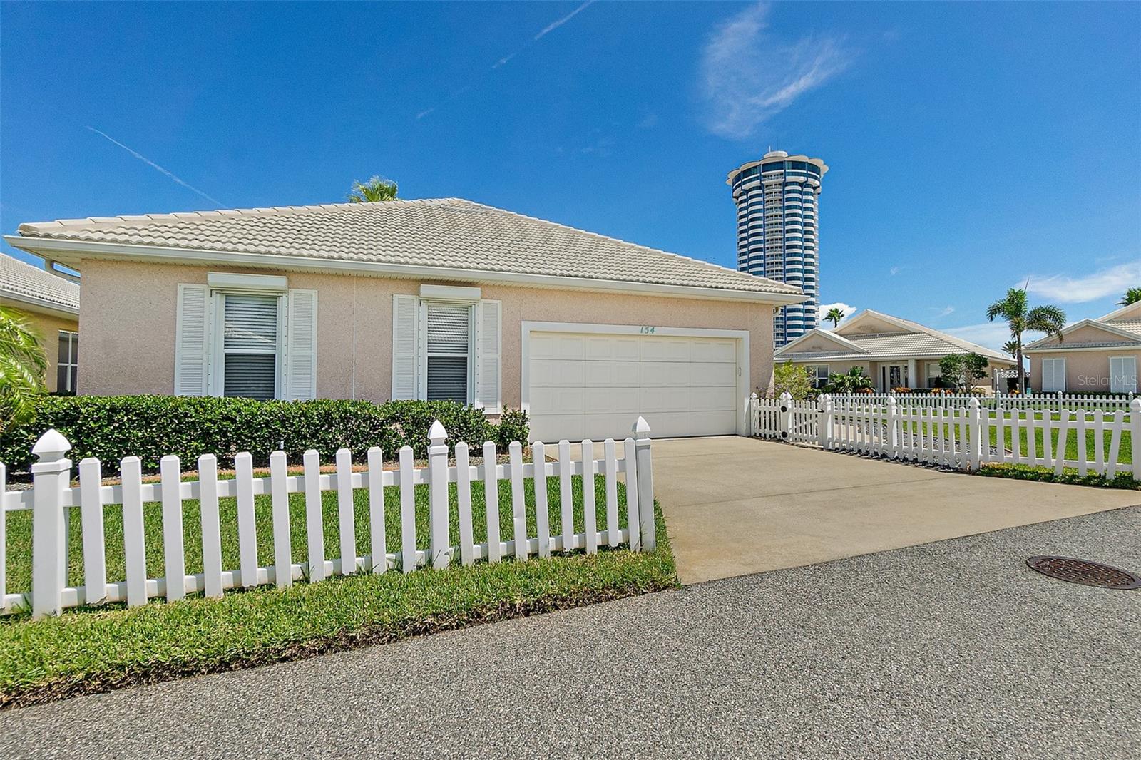 LOCATED IN A PRIVATE, GATED ENCLAVE OF 68 CHARMING KEY WEST STYLE HOMES DIRECTLY ACROSS FROM THE OCEAN. THIS FLORIDA DREAM HOME IS THE MOST CONVENIENT TO THE COMMUNITY POOL & CABANA, TENNIS AND PICKLEBALL COURTS. STEPS TO THE ONLY WALKOVER IN DAYTONA BEACH SHORES LEADING TO THE RESORT & SPA & ALL THE AMENITIES AT YOUR FINGERTIPS. SPA SERVICES, MASSAGE, FACIALS AND NAIL SERVICES, AN OCEANFRONT RESTAURANT SERVING BREAKFAST, LUNCH AND DINNER, OR ENJOY A DECADENT DESSERT AND GLASS OF WINE AFTER SPENDING THE DAY AT THE BEACH! THE KEY WEST STYLE EXTERIOR IS COMPRISED OF A CRUSHED SHELL SEASIDE TABBY STUCCO, A SIGNATURE FLORIDA FINISH, INCORPORATING A VARIETY OF COASTAL TREASURES, WHILE THE WHITE BARREL TILE ROOF COMPLEMENTS THE RELAXED AESTHETIC OF BOHO DESIGN. INSIDE YOU ARE GREETED WITH A BEAUTIFUL COFFERED FOYER CEILING INTO AN INCREDIBLY COMFORTABLE OPEN LIVING AREA THAT INVITES RELAXATION. BOTH LIVING AND DINING AREAS ARE ENHANCED WITH 10' CEILINGS AND CROWN MOLDING.
THE GOURMET KITCHEN SHOWCASES ESPRESSO CABINETRY, QUARTZ COUNTERS, A FULL SUITE OF SS APPLIANCES AND A DECORATOR FAVORITE BACKSPLASH. THE INDOOR LAUNDRY IS AN UPGRADE MOST REQUESTED BY BUYERS. THE SPLIT BEDROOM LAYOUT ALLOWS FOR ULTIMATE PRIVACY. THE ONLY 3 BEDROOM 3 BATHROOM FLOOR PLAN IN THE COMMUNITY MAKES THIS AN INCREDIBLE OPPORTUNITY THAT WILL NEVER COME ALONG AGAIN BECAUSE THIS CUSTOM HOME IS COMPLETELY ONE-OF-A-KIND AND TOTALLY SPECTACULAR IN EVERY WAY. THE PRIMARY SPA-STYLE BATH FEATURES VESSEL SINKS WITH A TRANQUIL, SOAKING TUB, PROMOTING RELAXATION AND SEPARATE SHOWER WITH A FRAMELESS GLASS ENCLOSURE. THE 2 BEDROOMS IN THE GUEST WING ARE EQUIPPED WITH THEIR OWN FULL BATHS. THE 4 SEASON PORCH IS AIR CONDITIONED & WOULD MAKE AN EXCELLENT ART STUDIO! THE GARAGE IS EQUIPPED WITH CUSTOM BUILT-IN STORAGE CABINETS AND FLOOR COATING. PROFESSIONALLY DESIGNED AND BEAUTIFULLY EXECUTED INDOOR/OUTDOOR LIVING SPACES WITH 1 MORE FAVORITE....THE OUTDOOR BAHAMA SHOWER!
INDULGE IN PURE TRANQUILITY IN DAYTONA BEACH SHORES' MOST ICONIC NEIGHBORHOOD. AT THE INTERSECTION OF LEISURE, MOVE-IN READY AND COASTAL LUXURY CONVENIENCES.