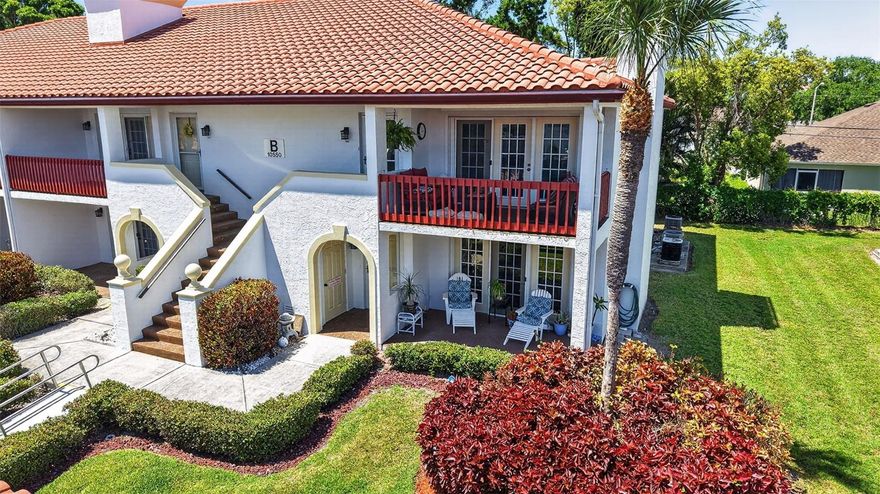Welcome to Village on Lake Seminole, a beautifully maintained Mediterranean-style waterfront community set along the shores of Lake Seminole. With its bright white buildings, red tile roofs, and lush, manicured landscaping, this community offers standout curb appeal and a relaxed Florida lifestyle. This updated 2-bedroom, 2-bathroom ground-floor end unit is light, bright, and move-in ready, featuring high-end wood-look laminate flooring throughout. The spacious layout includes a combined living and dining area with a cozy wood-burning fireplace, perfect for both everyday living and entertaining. The white kitchen has been fully updated with granite countertops, stainless steel appliances, and solid wood cabinetry. Both bedrooms are generously sized, with the primary suite offering a large walk-in closet and an updated en-suite bathroom. A convenient in-unit laundry room adds everyday practicality. Enjoy outdoor living with both front and rear patios—ideal for relaxing on warm Florida evenings. Residents have access to a community pool and dock, both overlooking Lake Seminole. The unit also includes a covered parking space and additional storage. Monthly maintenance fees cover water, sewer, trash, cable, and internet, providing added value and convenience. Ideally located just minutes from the shops, restaurants, and entertainment of Seminole City Center, and a short drive to the Gulf beaches, this property offers the perfect combination of comfort, convenience, and lifestyle.