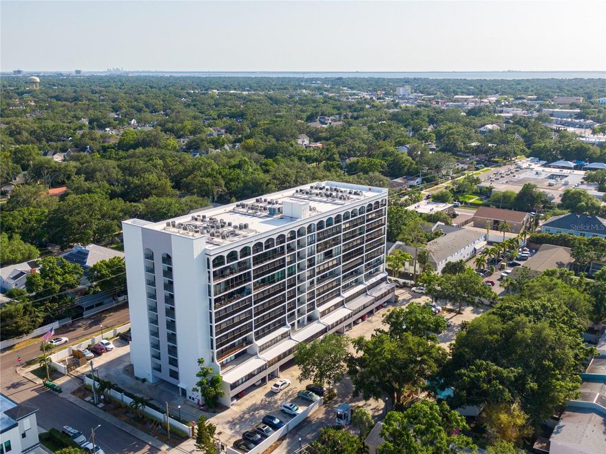 Experience effortless living in this urban oasis nestled in the centrally located Parkland Estates of South Tampa. This elegant condo checks every box, offering a secure guard-gated entrance, key-fob access, and the welcoming atmosphere you've been searching for. Step inside to discover a bright, open floor plan highlighted by stylish luxury vinyl plank flooring. The modern kitchen features stainless steel appliances, sleek countertops, and the convenience of an in-unit washer and dryer. Sunlight streams into the spacious living room, leading out to a generous patio where stunning city views set the stage for relaxation or entertaining guests.
The serene primary suite is designed for privacy and comfort, boasting a large walk-in closet, vanity, and a tub/shower combo. On the opposite side, a second bedroom and bathroom ensure versatility. The space is ideal for hosting visitors, working from home, or enjoying a peaceful retreat. Recent updates, including a newer air-conditioning system and hot-water heater, provide added comfort and efficiency. Park securely in your own deeded space beneath the building, while community amenities such as a pool, fitness center, and grilling area complete this exceptional living experience.  With this condo, you’re in a location that checks all the boxes; steps from top shopping, great schools, dining and medical care, with the ease of South Tampa condo-living at its finest.

All dimensions are approximate; all information intended to be accurate but cannot be guaranteed.
