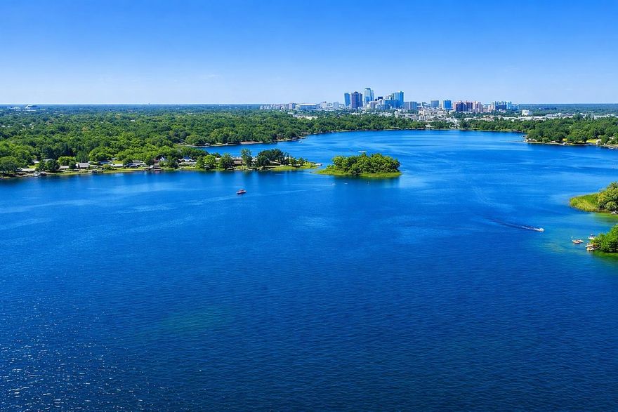 Over three acres on Lake Holden, and the moment you turn down the driveway, the city disappears. A long winding approach under a canopy of mature oaks sets the tone. Quiet, still, and entirely its own. This is the kind of lot that feels impossible to find this close to downtown Orlando, and it's ready for someone with vision. Direct frontage on Lake Holden, a private 300-acre spring-fed ski lake known for boating, wakeboarding, and some of the best sunsets in the city. Build a main residence positioned for the water views, a guest house, a dock, a detached workshop. There's room to do it right without compromise. Some of the groundwork is already done including established water and electric, cleared waterfront, 20 palms have been added to the landscape along with a fruit grove citrus, mangos, and papayas. Survey, tree survey, flood certificate, and environmental report are all in hand, giving a serious buyer a meaningful head start on planning, permitting, and design. Location is the quiet advantage here. Minutes to I-4, the 408, and the Beachline, with downtown Orlando, SoDo, Hourglass District, OIA, Disney and Universal are all an easy drive. Land like this on Lake Holden rarely comes available. Bring your builder, your architect, and your imagination.