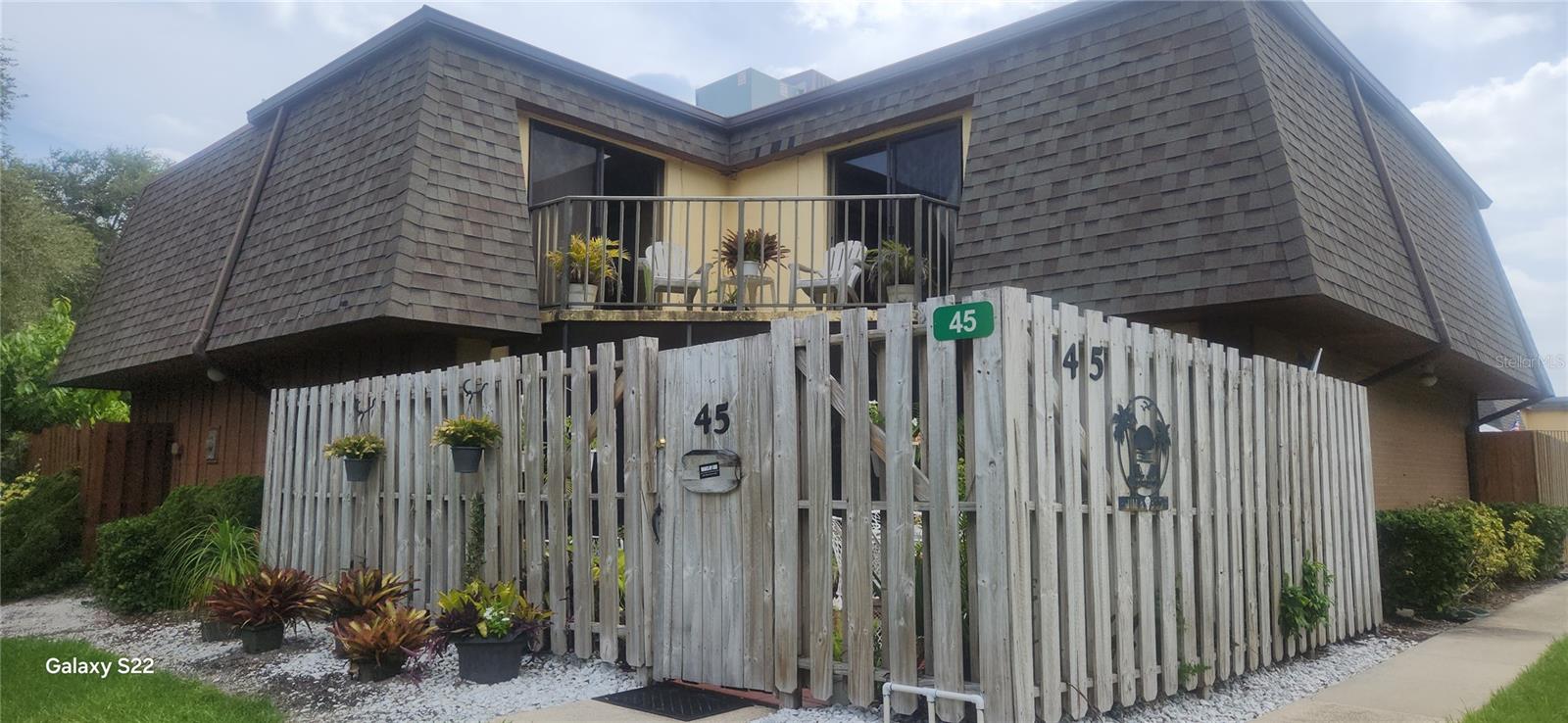 LOCATION LOCATION LOCATION..Charming Quad-Style Townhome just a short stroll to the beach at the east end of 27th Avenue—no-drive beach to the south, drivable to the north! Both bedrooms open to a shared northeast-facing balcony for ocean breezes and morning sun. Currently a month-to-month rental, this well-maintained home offers flexibility as an investment, getaway, or full-time retreat. Enjoy a spacious private patio behind a wooden gate—perfect for storing beach gear or relaxing outdoors. Low HOA and an unbeatable beachside location! Schedule your showing today.