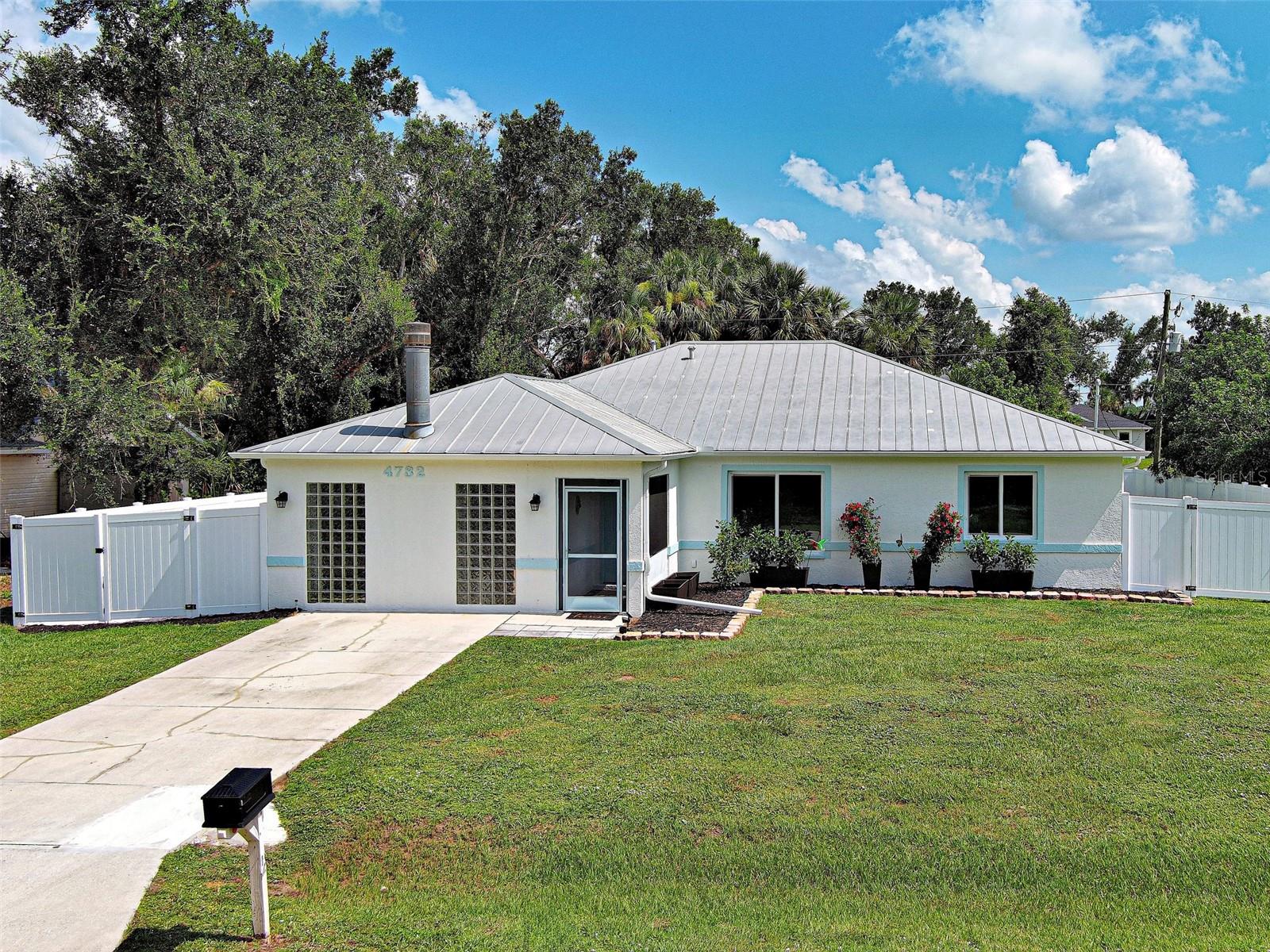 Welcome to 4732 Italy in North Port, Florida. Presenting this 1992, 1583 sq. ft. block home. 2/Bedrooms, 2/Baths, w/Flexi/Bonus Room and Lanai. Split floor plan, move-in ready. BEING SOLD "Turnkey Furnished". Available for immediate occupancy. Metal roof 2007, HVAC 2023, Hot Water Heater 2023. BRAND NEW IMPACT WINDOWS. Interior is freshly painted and dressed to impress! Step thru the front door and let's begin our tour. Vibe is clean, crisp and modern. Natural light fills the home. Many, many improvements. Great room is incredibly spacious. Outfitted with handsome new tile flooring. Great room has beautiful windows that invite the outside in. Attractive sliding glass doors that open to the lanai. Complete kitchen remodel. New cabinets, stone counters, stainless steel appliances. Center island so functional. Additional cabinetry and counter space added for storage and balance, perfect for dry bar or coffee bar. New cabinets built around the refrigerator. Primary Bedroom/En-suite combo really works. NEW SLEEP NUMBER BED. New flooring in the primary bedroom. En-Suite enjoyed a refresh as well. New sink, counter, toilet, fixtures and granite. Primary has Walk-In Closet. Guest bedroom has new flooring and closet. Guest bath updated with new sink, granite counter, new toilet and fixtures. The Flexi/Bonus room comes equipped with Murphy Bed. Glass tiles allow for privacy and natural light. So many uses for this room. Exterior has not been ignored. Freshly painted. Beds freshly mulched. Large backyard that is fenced with new PVC and chain link. Bring your "Toys" - RV's, trailers, boats. Double gates on both sides. Left side perfect for additional parking. Storage shed could be utilized as a workshop or storage for lawn equipment. Finishing our tour will be the covered lanai. Privacy screening, ceiling fan and ceramic tile flooring. So serene and peaceful. North Port has shopping, restaurants, so many conveniences. BEAUTIFUL DAYS, BEAUTIFUL NIGHTS, BEAUTIFUL FLORIDA!!! Ciao!