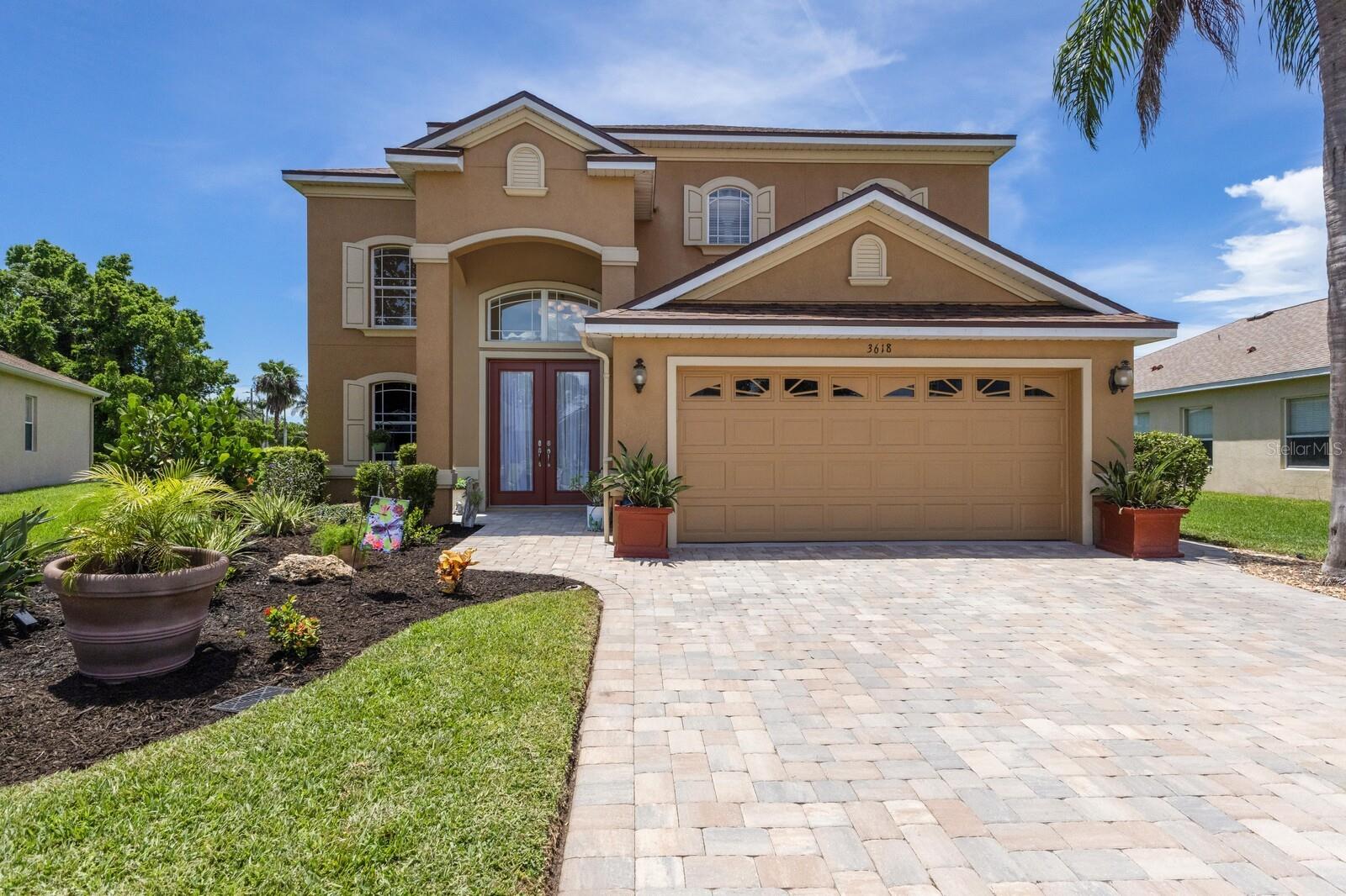 Welcome to Palma Sola Trace, a sought-after coastal community in Bradenton where resort-style amenities and an unbeatable location set the stage for the Florida lifestyle you have been dreaming of. Set on nearly a quarter-acre lot, this impressive two-story, five-bedroom pool home spans over 3,000 square feet and has been meticulously maintained and updated over the years. A pavered driveway and walkway lead you to the grand two-story entry, where wall-to-wall tile flooring welcomes you into the open-concept living space. The living room features a striking tray ceiling and a brand-new ceiling fan, while the updated kitchen boasts brand-new appliances, granite countertops, and a timeless subway tile backsplash. Enjoy both an eat-in kitchen and a formal dining area, offering plenty of room for entertaining.
The expansive first-floor owner’s suite showcases hardwood floors, a tray ceiling, dual walk-in closets, and a spa-like ensuite with dual vanities, a glass-enclosed walk-in shower, a garden tub, and a private water closet. Just off the living room, double doors open to a second bedroom with a closet that is currently used as an office, making it ideal for guests or multi-generational living. A convenient half bath is perfect for visitors. Upstairs, three additional bedrooms each feature brand-new ceiling fans and share a well-appointed full bath.
Step through the sliding glass doors to your private outdoor oasis. The pavered, screened-in lanai features a brand-new screen enclosure and overlooks an oversized heated saltwater pool with spa. Whether hosting friends or enjoying quiet evenings, this backyard is designed for relaxation. Recent major upgrades include a brand-new roof, two new AC systems for upstairs and downstairs with interior and exterior units, each with a 10-year transferable warranty, and a whole-house reverse osmosis system. Best of all, the home is in a no-flood zone, so flood insurance is not required.
Palma Sola Trace offers a maintenance-free lifestyle with a resort-style pool, fitness center, playground, and a clubhouse for gatherings. This community’s prime west Bradenton location puts you just minutes from world-famous beaches such as Anna Maria Island, Holmes Beach, Bradenton Beach, Coquina Beach, and Longboat Key. Spend your days exploring Robinson Preserve, Perico Bay, and De Soto Preserve with scenic trails for hiking and biking, or enjoy kayaking and birdwatching surrounded by Florida’s natural beauty. The community is also close to vibrant downtown Bradenton with its riverwalk, shops, dining, and cultural attractions, as well as Sarasota’s arts and theater district. Golf enthusiasts will appreciate the many nearby courses, while sports fans will love the proximity to the world-renowned IMG Academy and LECOM Park for spring training baseball. The Sarasota Bradenton International Airport is conveniently located just 15 minutes away, making travel a breeze. This home offers more than just a place to live, it delivers a lifestyle filled with convenience, recreation, and coastal charm. Schedule your showing today!