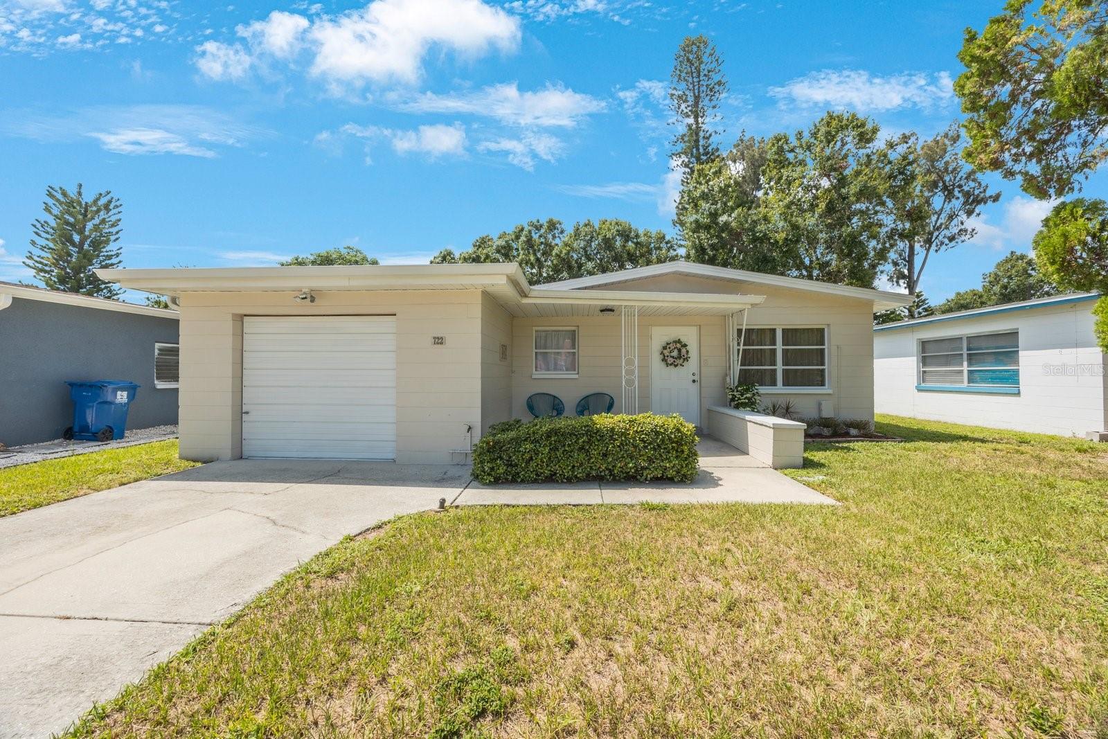 Step into this beautiful 3-bedroom, 2-bath block home tucked away in a quiet, established neighborhood in St. Petersburg. Thoughtfully updated with modern finishes and timeless charm, this residence is truly move-in ready. From the moment you enter, you're welcomed by a bright, open-concept living space featuring neutral-toned tile floors that run seamlessly through the space, making for easy upkeep and a clean, modern look. The open flow leads directly to the dining and kitchen areas, providing a welcoming layout for both daily living and entertaining. The primary suite is a cozy retreat with a stylish en-suite bath featuring a walk-in shower with custom tilework. Two additional bedrooms offer flexibility for family, guests, or a home office, with a shared second bathroom that has a custom vanity and Jacuzzi tub. The oversized backyard is fully fenced and features mature landscaping, a storage shed, and ample space for outdoor living or gardening. Located just minutes from downtown St. Pete, parks, shopping, and the Gulf beaches, this home blends convenience with comfort — and it’s ready for you to make it your own!