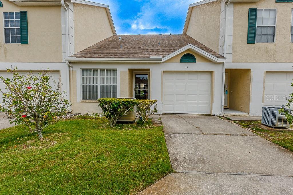 Charming 2-Bedroom Villa in the Heart of Palm Harbor! Welcome to this beautifully maintained 2-bedroom, 2-bathroom villa offering 976 square feet of comfortable living space and a spacious open floorplan. Featuring soaring cathedral ceilings, this home feels airy and bright the moment you walk in. The large master bedroom is a true retreat, featuring an elegantly renovated en-suite bathroom with a custom vanity topped with a granite countertop, an undermount sink with an oil-rubbed bronze high-mount faucet, a custom mirror, a new toilet, and upgraded towel and paper holders. Crown molding adds a polished touch, while the updated shower offers a built-in seat and beautiful custom tile work. The guest bathroom includes a shower and pedestal sink, ideal for visitors or family. Enjoy peace of mind with plenty of storage throughout, and convenience with a 1-car garage. Step outside to your private screened rear patio, perfect for relaxing with morning coffee or evening breezes. HOA dues cover exterior maintenance, painting, garbage, and access to the clubhouse and pool, making for easy, low-maintenance living. Located in the desirable Palm Harbor community, this home is minutes from Downtown Palm Harbor, the Pinellas Trail, and the Dunedin Causeway. Zoned for top-rated schools including Highland Lakes Elementary, Palm Harbor Middle, and Palm Harbor University High School. Don’t miss your chance to own this incredible home in a prime location — schedule your private showing today!