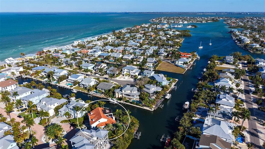 Rarely does a home of this architectural distinction and waterfront presence become available on Anna Maria Island. Tucked within the private residential enclave of Villa Rosa, this custom-built coastal estate offers a level of craftsmanship, privacy, and lifestyle reserved for the island’s most exceptional properties. Inspired by timeless European architecture, the residence is defined by reclaimed wood beams, marble flooring, handcrafted millwork, and curated designer finishes that create interiors both refined and welcoming. The chef’s kitchen serves as the heart of the home, featuring a statement Lacanche range, Sub-Zero refrigeration, custom cabinetry, and an expansive island designed for gathering and entertaining. Outdoor living unfolds as a private resort experience. A fully equipped Lynx outdoor kitchen, built-in pizza oven, covered lounge with wood-burning fireplace, and multiple terraces create effortless spaces for entertaining or quiet retreat. The rooftop observation terrace offers panoramic island views and becomes the perfect setting to watch sunsets paint the sky over the Gulf. Surrounded by lush tropical landscaping, the private pool and grounds evoke the feeling of a secluded coastal sanctuary. Positioned on a protected deep-water canal with direct, bridge-free access to Tampa Bay and the Gulf of Mexico, the private dock and 10,000-pound lift allow boating to become part of everyday life. Villa Rosa is one of Anna Maria Island’s most desirable residential communities, where rental restrictions preserve a quiet, private neighborhood atmosphere free from transient turnover. Just moments away, residents enjoy world-renowned powder sand beaches, waterfront dining at iconic destinations, boutique shopping along Pine Avenue, and the relaxed coastal lifestyle that defines Anna Maria Island. This is more than a home. It is a rare opportunity to own one of the island’s most architecturally significant and lifestyle-driven waterfront residences. Matterport tour is available.