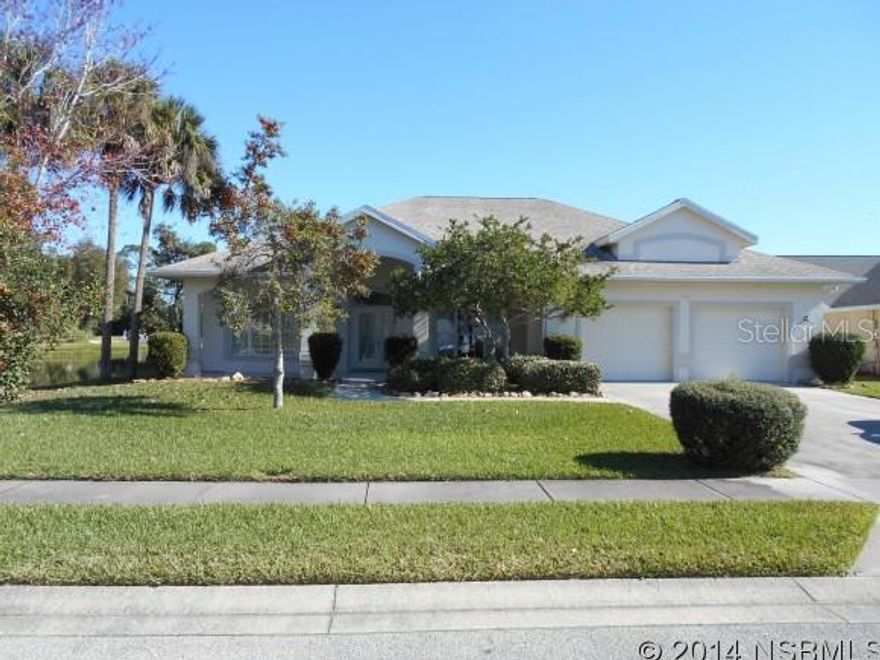 This is a beautiful classic home in a golfing lakefront planned community.  When living here you will find yourself mostly sun bathing by your screened in pool watching the ducks glide across the nearby lake as golfers play their game.  A long covered patio graces the front entry.  Inside is an open floor plan with the dining area separated to the right and straight ahead opens to a long wide living room and family room then the screened pool and lake on 2 sides.  Vaulted ceilings and an open split bed room floor plan make this easy living. ;Water: City