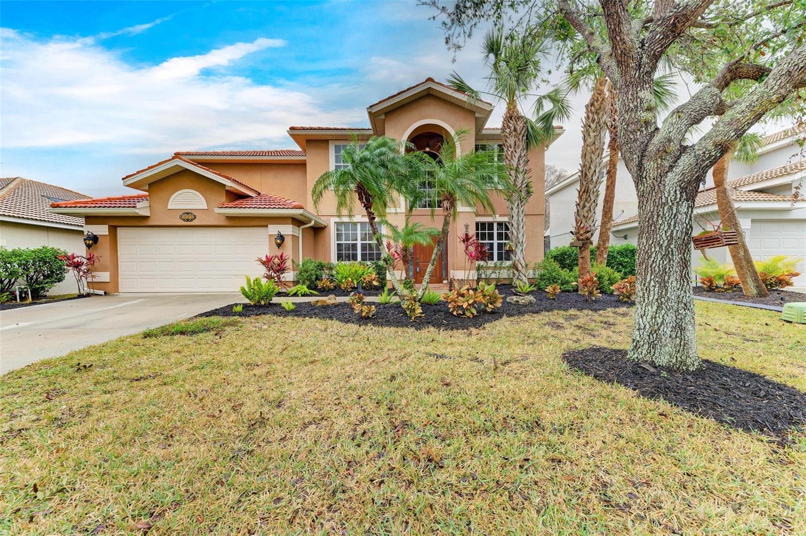 Gorgeous 3027 total sq.ft. home in gated golf course community. This home has it all! Soaring 2 story ceilings to open game room upstairs to the RESORT STYLE POOL area looking onto the PRESERVE for ultimate privacy. Beautiful 3 or 4 bedroom, 2.5 bathroom home with office and bonus area. One of the few two-story larger homes in the gated subdivision of Stoneybrook Heritage Harbour. Entry way with spacious living room and dining room with SPECTACULAR CHANDELIER. Family room open to kitchen with closet pantry, slate appliances, granite counters, gorgeous chevron backsplash and dinette area. Large office, den or game/media room. Half/pool bath opens to screened lanai. Under air laundry room with cabinets and closet. 2 car garage with laundry tub and refrigerator. The living areas are on the 1st floor with tile throughout and sliding glass doors to pavered pool area. 2nd floor boasts 3 bedrooms split floor plan, 2 bathrooms, media/game room. Game/media room opened to 1st floor views. OVERSIZED PRIMARY BEDROOM AND BATHROOM RETREAT with walk-in closet and en-suite. Tranquil primary bathroom boasts garden tub with window, separate shower, dual sinks and water closet. Bedroom 2 overlooks pool area. Bedroom 3 overlooks front of home. 2nd bathroom with tub/shower. Spectacular pavered HEATED POOL WITH SPA/HOT TUB area with screened lanai, lots of room for dining and sectional seating entertaining, curtains for privacy, lighting, FOUNTAINS and SUNDECK. Professionally landscaped with privacy around pool, crepe myrtle trees, plumeria tree and more. Sprinkler system. Exceptional views of preserve for ultimate privacy. Hurricane shutters included. THIS HOME IS NOT IN A FLOOD ZONE AND HAS NEVER FLOODED. CDD fee is included in property taxes. LOW HOA FEE $135 MONTHLY includes clubhouse/recreational center for parties, heated community pool, ikids splash pad with fountain, fitness center, dog park, basketball court, 8 pickelball courts, 2 tennis courts, bocce ball, sand volleyball, and playground. OPTIONAL GOLF AND SOCIAL CLUB MEMBERSHIP AVAILABLE with 18-hole golf course, clubhouse with Lighthouse Pizza and Grill restaurant, social clubs,/planned activities, heated resort style pool and spa, and fitness center. Outside the gates Heritage Harbour Park offers baseball field, picnic tables, 2 mile walking path, restrooms, playground and 9 hole disc golf course. Close to world renown gulf beaches, I-75, theme parks, major league sporting events, shopping, dining, fast food, pharmacies, medical centers. Target, Whole Foods, Chick-fil-A, Longhorn Steakhouse, Hobby Lobby, Panda Express, Sports Academy, Cheddars, First Watch, and more going in beside Costco. Come live the Florida life-style today! This one is a must see!