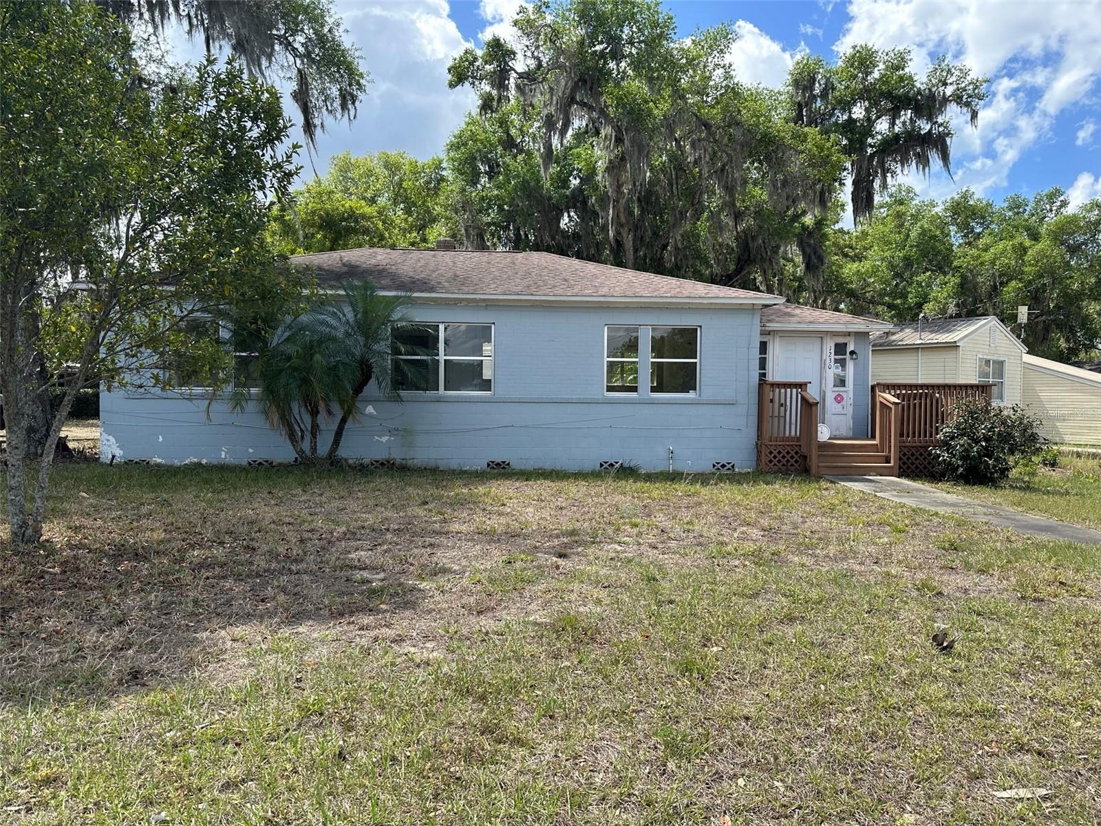 3/1, Single Family Home, Living Room, Dining Room, Kitchen with Appliances Included: Stove, Refrigerator, Wood Laminate and Tile Throughout, Each Bedroom Has Built-In Closet, Drawers, & Mirror, Partially Fenced Yard, Open Front Patio with ramp, NO SMOKING, NO Pets, Pest Control Included, Year Built: 1949/ 1033 Sqft.