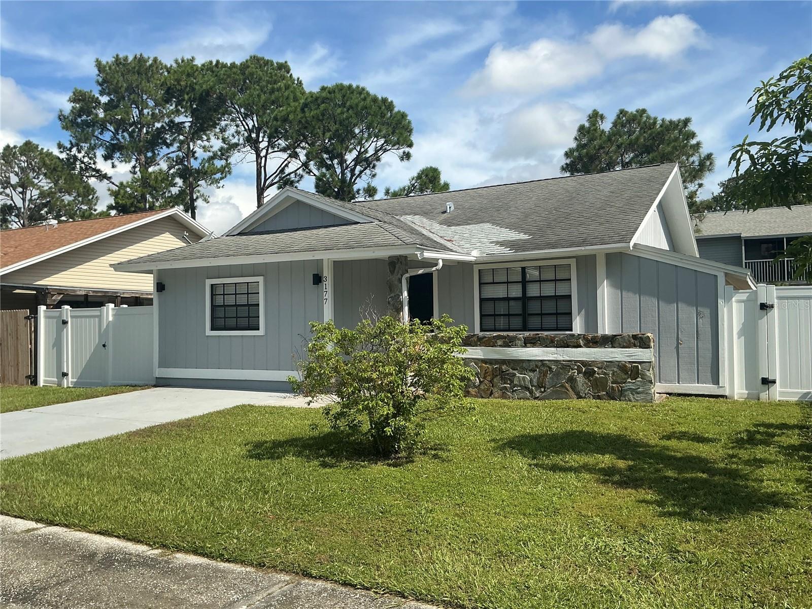 Welcome to this stunning, fully renovated three-bedroom, two-bath home located in the heart of Largo. This residence has been thoughtfully updated, creating a modern and inviting space. New laminate floors that stretch throughout the entire home, providing a sleek and cohesive look. Freshly painted interior complemented by high ceilings. Open airy space! The kitchen is updated and features brand new white shaker cabinets with soft-close mechanisms for added convenience. Beautiful quartz countertops offer ample workspace, paired perfectly with new stainless steel appliances. The master bedroom is a tranquil retreat, complete with a spacious walk-in closet. The en-suite bathroom has been completely renovated to include a walk-in shower, modern vanity and sink. Super cool with a brand new A/C system. Outside, you'll find a charming covered porch ideal for grilling and outdoor entertaining. The backyard is fully enclosed with a brand new white vinyl fence, ensuring privacy and safety. This home is situated in a desirable neighborhood in Largo, offering a blend of convenience and serenity. With its modern upgrades and thoughtful design, this home is ready to provides comfort and style. Don’t miss the opportunity to make it yours!