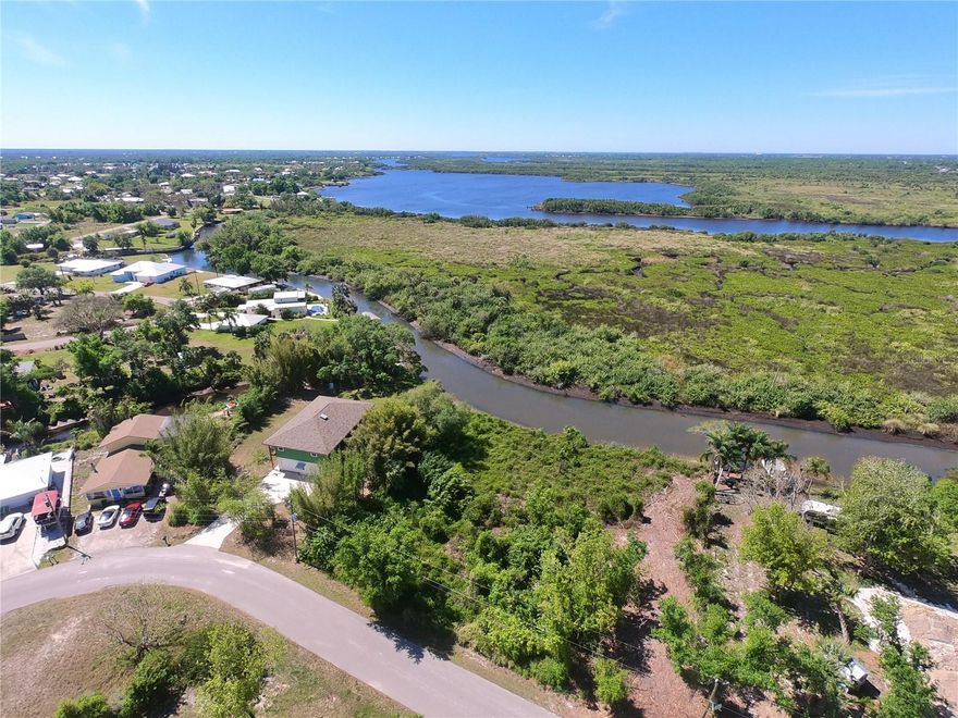 Build your dream home(s) on these DOUBLE WATERFRONT lots in Peace River Shores! Nearly 3/4 of an acre! A tidal waterway leading directly into Jim Long Lake onto Charlotte Harbor for amazing sight seeing, boating and fishing in the tranquil waters of the upper stretches of the Peace River. Just imagine how wonderful it will be, the ability to travel to open water including the Gulf of Mexico all from your backyard! Canal front lots consist of 2 parcels that are being sold together (PID 402301151010 & 402301151011) and on a dead end road for added privacy. ( LOTS 114, 115, 116, & 117). Overlooking an "Environmentally Sensitive" land preserve protecting your view, so no concerns about any neighbors across the canal. SIMPLY ENJOY SUNSETS AND NATURAL WILDLIFE. Optional membership available in Peace River Shores HOA to use the community boat ramp and clubhouse, boat launch, and docks available for  low annual fee. Golf cart friendly community, no deed-restrictions. Located just off Route 17, close to I-75, historic Punta Gorda and arcadia, PG airport, dining and boutique shopping.
Minutes to I-75 and PGD airport. Prepare to fall in love with this one of a kind, OLD FLORIDA STYLE community, ready to make your Florida dreams to come true.