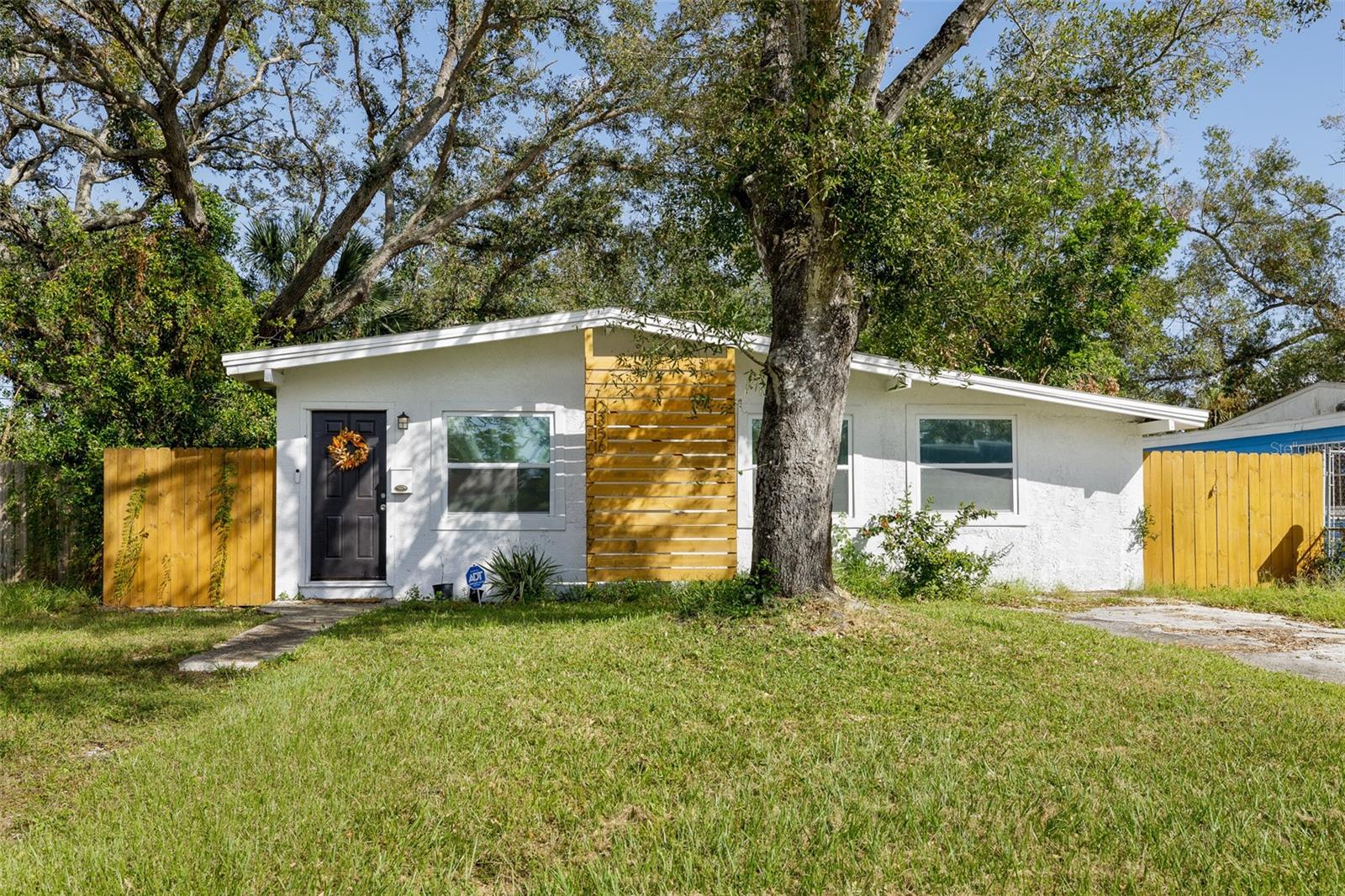 Charming 3-bedroom, 1-bath bungalow in the heart of St. Petersburg! This light-filled home offers an easy, open flow with plenty of space for relaxing or entertaining. A generous fenced backyard provides room for outdoor dining, or gardening. Conveniently located just minutes from vibrant downtown St. Pete, Grand Central shops and restaurants, and the award-winning Gulf beaches, 2356 Kingston St S is perfect as a primary residence, vacation getaway, or investment property.