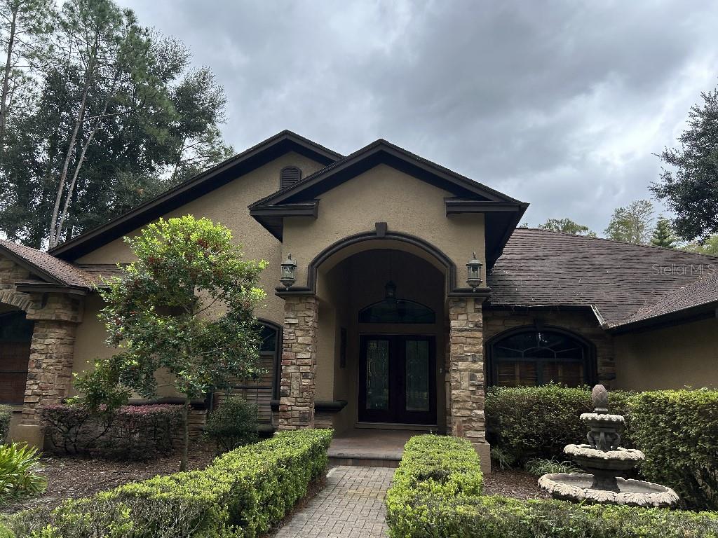 5,651 SF under roof. 3,,578 SF heated and air conditioned. No Flood Insurance Required. EXCEPTIONALLY UPGRADED, FORMER MODEL home, PLUS a $200K+ CUSTOM BUILT, fully screened, OUTDOOR OASIS & LODGE STYLE ENTERTAINMENT AREA to complement the TROPICAL, LAGOON STYLE POOL w relaxing ROCK WATERFALL SPA & upgraded TRAVERTINE PAVER deck. Inside, the desirable 3 WAY SPLIT bedroom floor plan consists of 4 bedrooms, 3 baths, FORMAL living & dining areas, a WELL APPOINTED KITCHEN w dinette nook, FAMILY ROOM w Gas FIREPLACE, private OFFICE, a huge BONUS rm & a 3 CAR side load garage. Step outside the master, family, 3rd bath or bonus into the spacious resort style outdoor retreat w PINE WOOD ceiling, TREK DEK flooring, a PUTTING GREEN, a GAS FIREPLACE and a FULL KITCHEN w GRANITE counters & bar, JENN AIR gas grill, 2 refrigerators, built in OVEN and Microwave, & even a dishwasher located just off the pool! This executive style home sits on .94 ACRE in a small, GATED COMMUNITY & boasts a CIRCULAR drive, lush landscaping AND a FULLY FENCED backyard ALL OVERLOOKING peaceful CONSERVATION. A backyard garden area to grow your own herbs and vegetables. NEW ACs in 2024 & 2020 *WOOD FLOORS in Living Room & Office * 18" TILE in wet areas & family * PLANTATION SHUTTERS thru-out * DOUBLE CROWN MOLDING/TRAY CEILINGS * WINDOW TREATMENTS * EXTENDED MASTER SUITE w sitting area * built in SURROUND SOUND SPEAKERS throughout * UPGRADED LIGHTING * INTERIOR DRY BAR w WINE FRIDGE * REVERSE OSMOSIS in Kitchen * Wall built-ins *Jetted tub in master bath * SOLAR heated salt water pool * Outdoor SECURITY lights & cameras & more! New roof will be provided by owner.