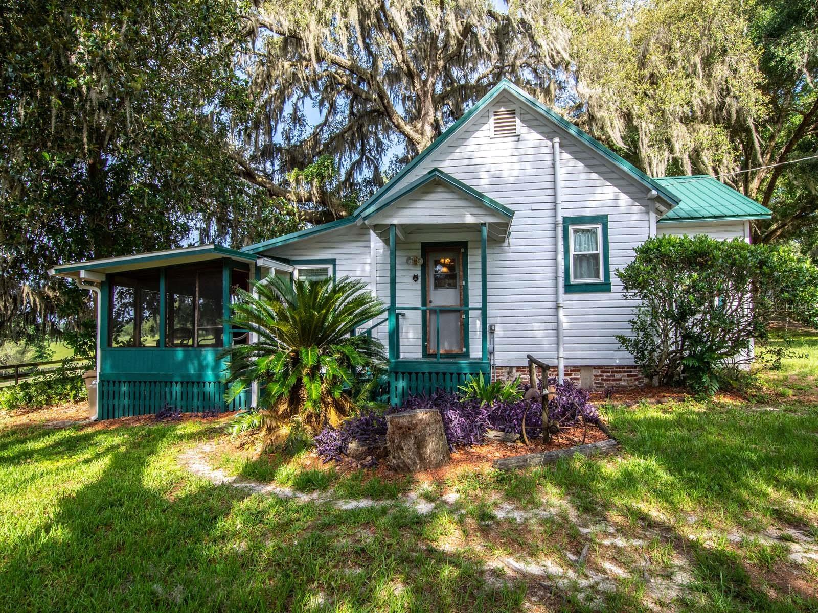 VINTAGE COTTAGE could be your TRENDY Tiny House with 9ft ceilings, Fl Cracker-Style! ROLLING HILLS out back, and fenced
and cross fenced with LUSH PASTURES! Almost 6 ACRES, there is plenty of SPACE to enjoy, even electric hook up for your LQ
horse trailer. The Ocala National Forest is just minutes by HORSEBACK, and an active TRAILRIDING COMMUNITY. Located in
this hidden gem of equestrian heaven- you will relish the green views and enjoy all the simplicity of the country surroundings. This
has been an AWESOME winter RETREAT for snowbirds in the past and the community welcomes new full timers too! Near Rocking
Horse Ranch for the Winter EQUESTRIAN CIRCUIT, about an hour to Orlando, Ocala, or Daytona, and even closer for dining and
entertainment in quaint Mount Dora or The Villages. The house acquired 2 new ACs & windows in 2019. HOUSE METAL ROOF and
barn roof were UPDATED IN 2018. The HORSE BARN is about 24 x 32 and offers 2 run-in stalls, covered shaded sitting area,
plentiful hay storage space, feed room, equipment parking and a WORKSHOP. This is A STEAL with all these improvements,
especially considering the price of recent vacant land sales! SO, call today for your appointment.