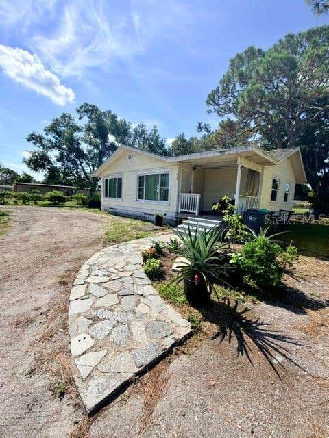 Photo of 420 53rd Avenue E, Bradenton, FL 34203 (MLS # A4698564)