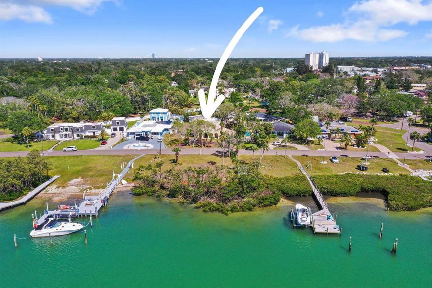 COME AND BUILD YOUR NEW HOME ON HISTORIC SUNSET DRIVE!!! Attention Builders and Developers! Do not miss this incredible opportunity to own this beautiful waterfront property IN THE HISTORIC OLD PASADENA AREA with INCLUDED WATER LOT Across Sunset Drive (19-31-16-00000-330-0200), OVERLOOKING THE SPARKLING WATERS OF BOCA CIEGA BAY and west facing for breathtaking sunset views; BOTH LOTS COMBINED EQUALING 1 ACRE M.O.L.! 101-foot-wide double lot and 97 feet of waterfront that extends hundreds of feet into the bay. No seawall, just natural barrier, so no seawall maintenance. WEST FACING FOR PERFECT FLORIDA SUNSETS! ENJOY ALL THE BENEFITS OF LIVING ON THE WATER BUT WITH THE ADDED BENEFIT OF ALSO HAVING A LARGE PRIVATE BACK YARD WITH POOL AND ALLEY ACCESS. This property is so quiet and peaceful; it is the perfect location for living the best beach life but without the drawbacks of being on the barrier islands with all the tourist, hotels etc. Located right around the corner from Palms of Pasadena Hospital and an easy drive to Downtown St. Pete, I275 and a 5 minute drive to Treasure Island or St. Pete Gulf Beaches. Zoned for an ADU (accessory dwelling unit), A RARE AND VALUABLE FEATURE! Property was impacted by Hurricane Helene and no repairs will be done by the sellers. Property being sold as is. Information on this property has been provided by both the seller and public records and is believed to be accurate, but buyer should verify all information and conduct any research they deem necessary for their purchasing decision up to and including building/zoning and FEMA Requirements. WATERFRONT PROPERTIES AND OPPORTUNITIES LIKE THIS RARELY BECOME AVAILABLE, SO CHECK THIS ONE OUT BEFORE IT'S GONE!