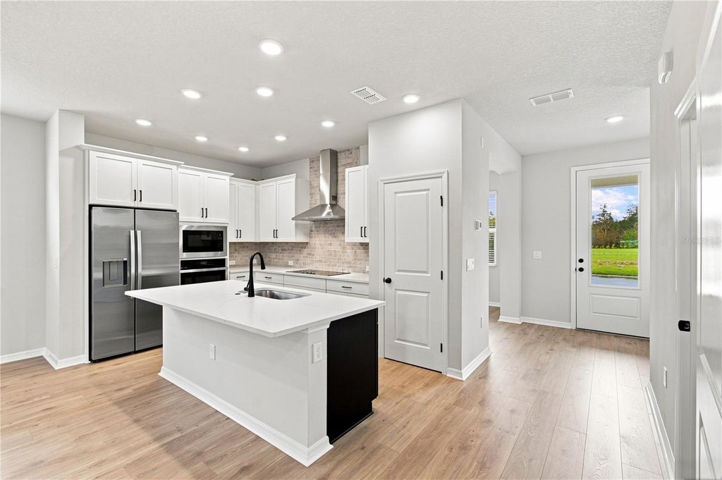 Photo of 5617 White Ibis Point, Saint Cloud, FL 34772 (MLS # TB8555929)