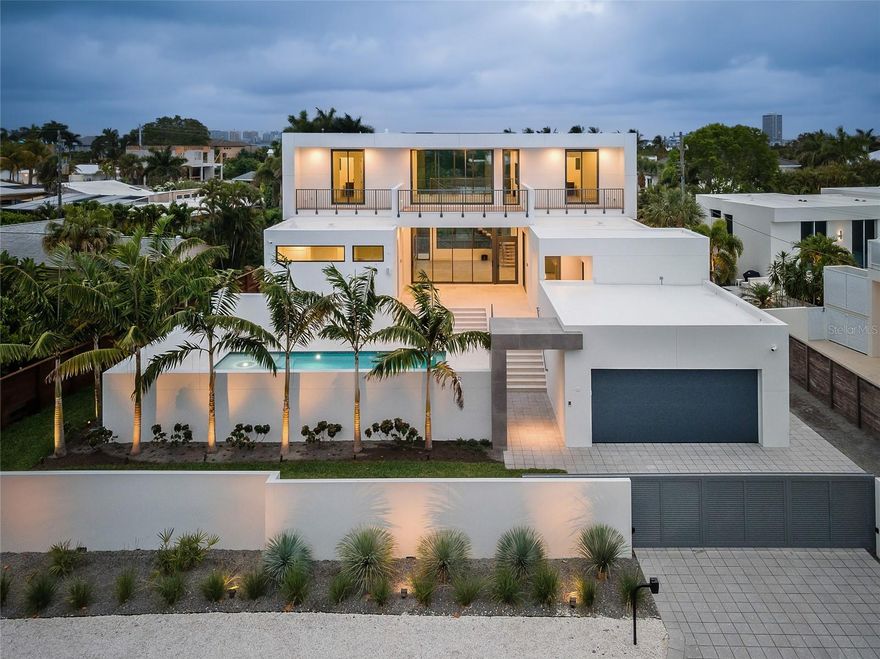 Looking for a new construction home that did not take on flooding during either Hurricane? This modern residence epitomizes luxury living in one of Sarasota’s most coveted coastal neighborhoods, Lido Shores. With a harmonious blend of sleek design and built to or above all current hurricane codes, this home offers an unparalleled lifestyle just steps from your private access to the Gulf of Mexico.

Spanning almost 4,000 square feet, this exquisite property features 4 spacious bedrooms and 5 beautifully appointed bathrooms, ensuring ample space and privacy for both residents and guests. The open-concept living areas are bathed in natural light, showcasing the finest in contemporary finishes and architectural details.

Every inch of this home has been thoughtfully designed for those who desire the pinnacle of modern luxury. The homeowner added numerous custom upgrades throughout construction, with state-of-the-art amenities designed for ultimate comfort and convenience. High-end Thermador appliances anchor the gourmet kitchen, while electric Toto Washlet toilets add a touch of luxury to the bathrooms. Customized closets provide ample storage, and smart home technology is seamlessly integrated throughout, including automated shades, built-in speakers, high-definition televisions, and strategically placed wireless access points.

The property also features a generator for added peace of mind and is pre-wired for solar panels, offering an eco-friendly energy solution.

Step outside to discover your private oasis. The courtyard pool, surrounded by lush landscaping, creates a serene environment perfect for relaxation or entertaining. The rooftop terrace offers panoramic views of the Gulf and downtown Sarasota, providing an idyllic setting for sunset gatherings or quiet reflection. Adding to the allure is the home’s private beach access, allowing you to enjoy the pristine sands and crystal-clear waters of Lido Key whenever you desire.

This property, built by Seaward Homes, truly embodies the essence of luxury coastal living, where every detail has been meticulously crafted to deliver the ultimate in comfort, style, and sustainability. For $1,378/sf it could not be replicated at this price in today's market. Schedule a showing today! Staging is virtual.
