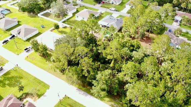 This high and dry vacant lot is perfectly situated in the heart of Palm Coast, offering a prime location close to shopping, top-rated schools, and just a short 15-minute drive to the beautiful Atlantic beaches. With no HOA fees and no build-time restrictions, you have the freedom to develop on your timeline or simply hold as a solid investment. Whether you're planning to build now or later, this is an excellent opportunity to secure land in a growing area. Don't miss out — invest in your future today!