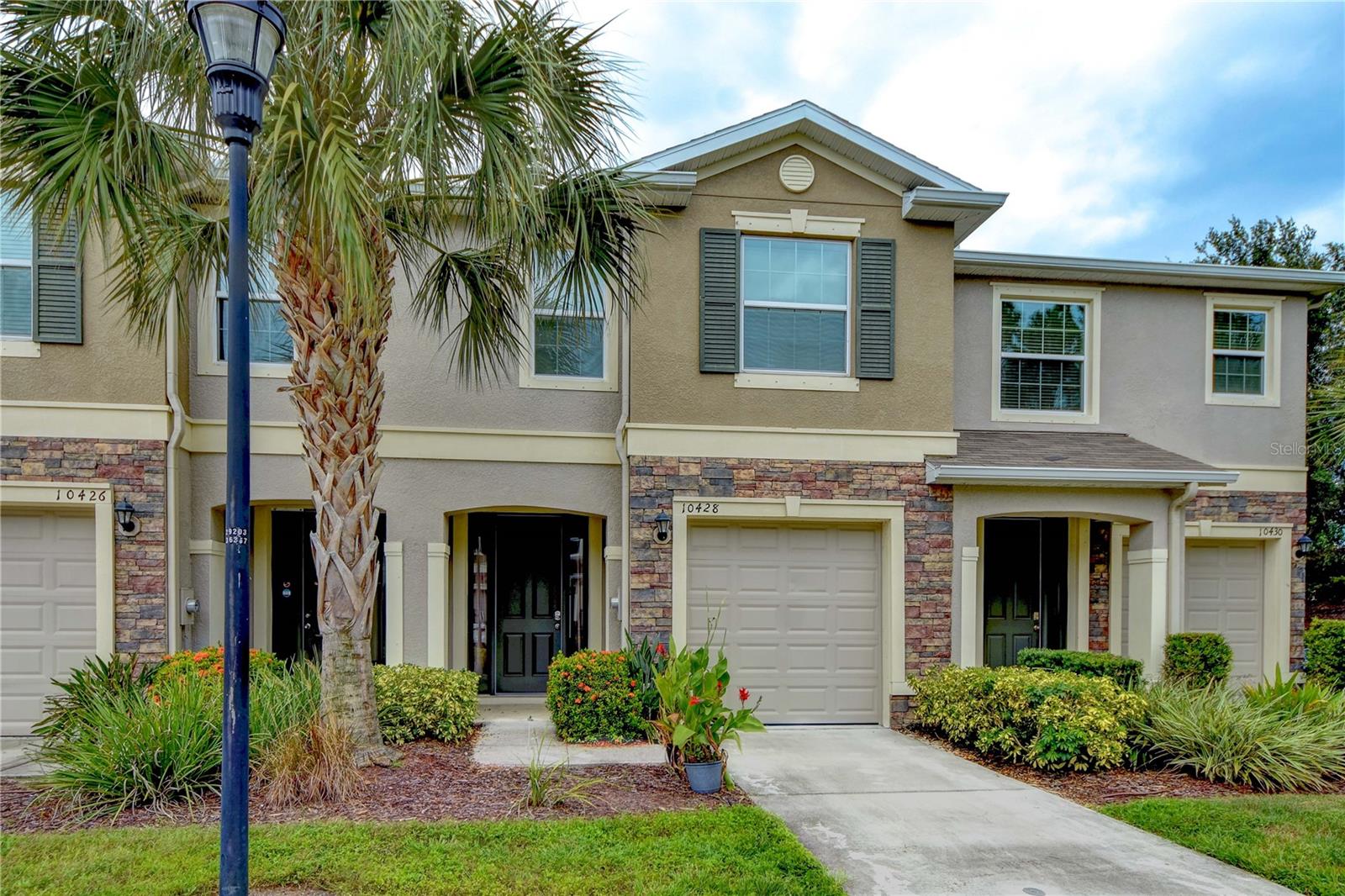 Welcome to the beautiful, gated community of The Cove at Avelar Creek! As you enter into the home, you'll be greeted by a spacious foyer that showcases an open floor plan kitchen/dining room combo overlooking the great room. The kitchen boasts a large island with granite counters, a generous walk-in pantry, 42" cabinets, and stainless-steel appliances. Notably, there's a one-year-old convection range with an air fryer feature, perfect for cooking enthusiasts. The great room is a highlight of the home, featuring a three-slider door that leads to a large, private screened-in lanai. This lanai offers a serene space to relax and unwind, with the added benefit of no backyard neighbors. It's an ideal spot for enjoying the outdoors in privacy. Moving upstairs, you'll find a laundry closet equipped with a brand new washer and dryer. Additionally, there are three bedrooms and two full baths on this level. The primary suite stands out with its two closets, providing ample storage space. The secondary bedrooms also offer spacious closets, ensuring plenty of room for all your belongings. The interior of the home has been recently professionally painted in pleasing, muted colors, creating a fresh and inviting atmosphere. Furthermore, the property comes with a newer whole house water softener and purification system, including a kitchen tap. This feature ensures that you'll have access to clean and purified water throughout the home. In terms of recent updates, the garage door opener was fully replaced just a few months ago, and the garbage disposal is less than a year old. These updates contribute to the overall functionality and convenience of the home. The community offers a range of amenities, including a pool, playground, and clubhouse, providing opportunities for recreation and socializing. Conveniently located just off US-301, with easy access to I-75, this home is in close proximity to St. Joseph's hospital. It's also conveniently situated near restaurants, shopping centers, and other activities, ensuring that you'll have everything you need within reach. Don't miss out on this fantastic opportunity! Call today to schedule a viewing and experience the charm and convenience of The Cove at Avelar Creek.