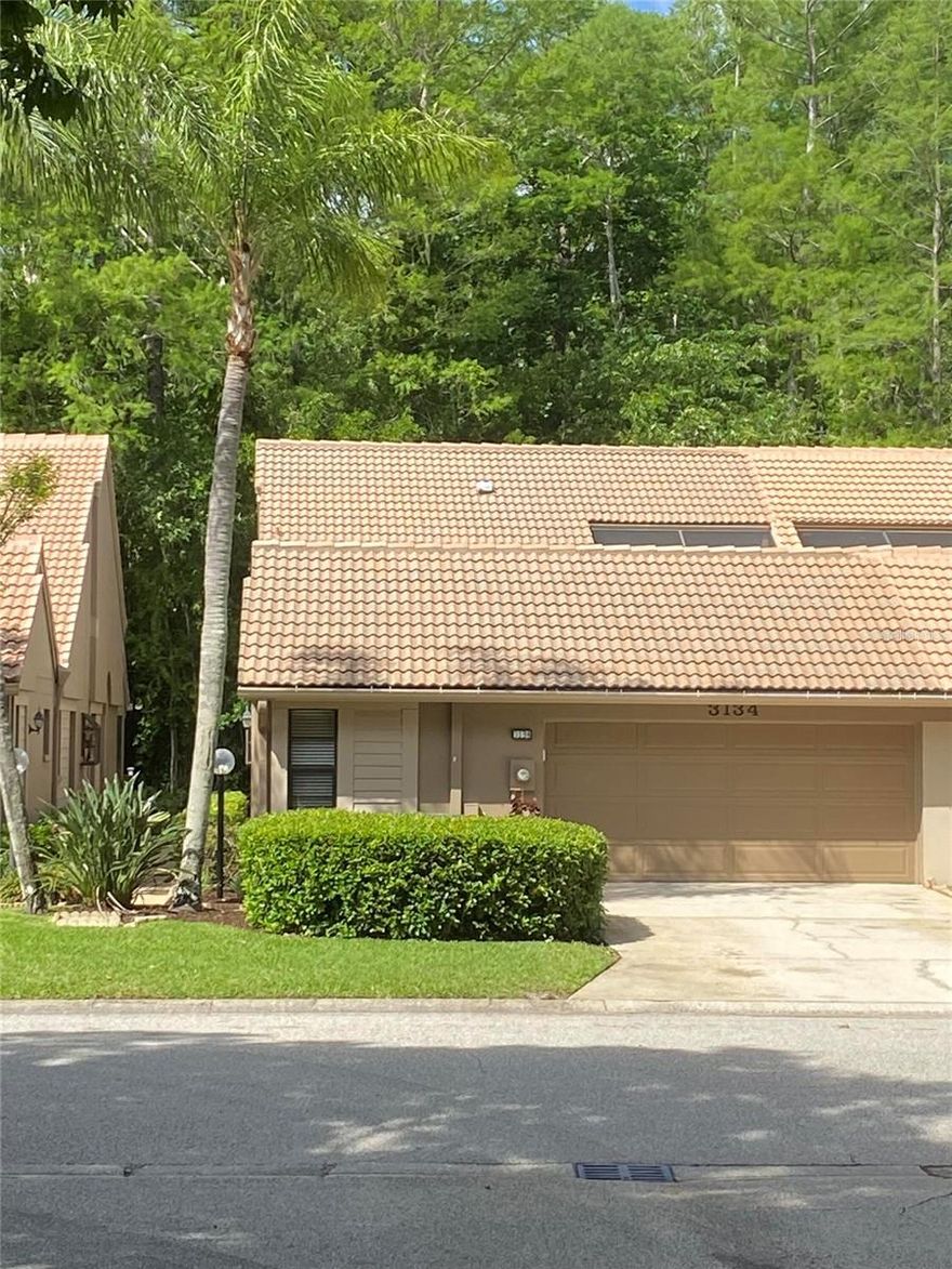 Experience easy, low-maintenance living in this fully renovated villa set on an oversized 0.48-acre homesite with peaceful preservation views. Designed with both comfort and functionality in mind, this home features a bright split floor plan, soaring vaulted ceilings, and a unique central atrium that fills the space with natural light.
The interior has been extensively upgraded throughout, including 24” porcelain tile flooring (no carpet), fresh paint, 5” baseboards, and modern Decora-style switches and outlets. The inviting living area is anchored by a wood-burning fireplace adds character and creating a warm, inviting atmosphere to the main living area.
The kitchen, completely redesigned in 2022, features stylish cabinetry, Natural stone calcite countertops, tile backsplash, a Bosch dishwasher, new oven, and expanded storage with additional pantry cabinets and a dedicated coffee bar. A walk-in pantry enhances everyday convenience.
The primary suite serves as a private retreat and features a walk-in closet with a beautifully reimagined bathroom (Dec 2022) with a large spa-style walk-in shower, luxury fixtures, double vanity, and upgraded lighting. The guest bathroom has also been updated with granite countertops and flooring.
Flexible living space includes a den with built-in shelving, commonly used as a third bedroom or home office. Each bedroom includes a walk-in closet, and new plantation-style bifold doors provide a clean, cohesive look throughout.
Outdoor living is just as inviting, with a screened lanai that includes a covered area designed for relaxing or hobbies, plus updated tilework with flagstone look on both front and rear porches. The expansive lot and rear greenspace create a sense of privacy and tranquility.
Additional upgrades include a Trane A/C system (Aug 2022) with transferable warranty, water softener, EV charging sub-panel (2023), and a 2-car garage with storage system, hurricane rated insulated garage door and new opener (2025). The laundry area has also been enhanced with a utility sink and cabinet.
Community amenities include a solar-heated pool, and the HOA provides yard and pool maintenance.
This move-in ready villa combines thoughtful upgrades, spacious design and tranquil surroundings – an exceptional opportunity you won’t want to miss.