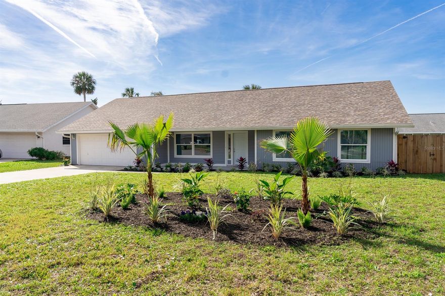This beautifully updated home sits on a quiet cul-de-sac in the heart of Port Orange and is loaded with features and upgrades. There is space for the whole family to spread out with a living room off the kitchen (with vaulted ceilings), a breakfast nook, oversized screened in lanai, and a bonus room that could easily be closed off or made into another bedroom. Kitchen features new cabinetry, new sink, granite countertops, pantry, and all new Samsung appliances, including a four-door french door refrigerator with water dispenser/ice maker. Other updates include fresh paint inside, new hot water heater, new guest bathroom vanity, new carpet in the guest rooms and living rooms, and new fans and new interior doors. Roof, windows, and glass sliders replaced in 2020. The large primary bedroom has a new ceiling fan and a barn door into the sanctuary of the en-suite. In the en-suite you are greeted with a double-sink floating vanity, a custom tiled glass-enclosed shower, and a fully customized walk-in closet. Plenty of storage with customized hall closets, not to mention the attic space with access from pull down steps in the two car garage. The yard is fenced and you can rest assured the new tropical landscaping is taken care of by the irritation system. Sleepy Hollow offers a convenient location and voluntary HOA for $275/yr that includes use of the pool and tennis courts. ;Water: City